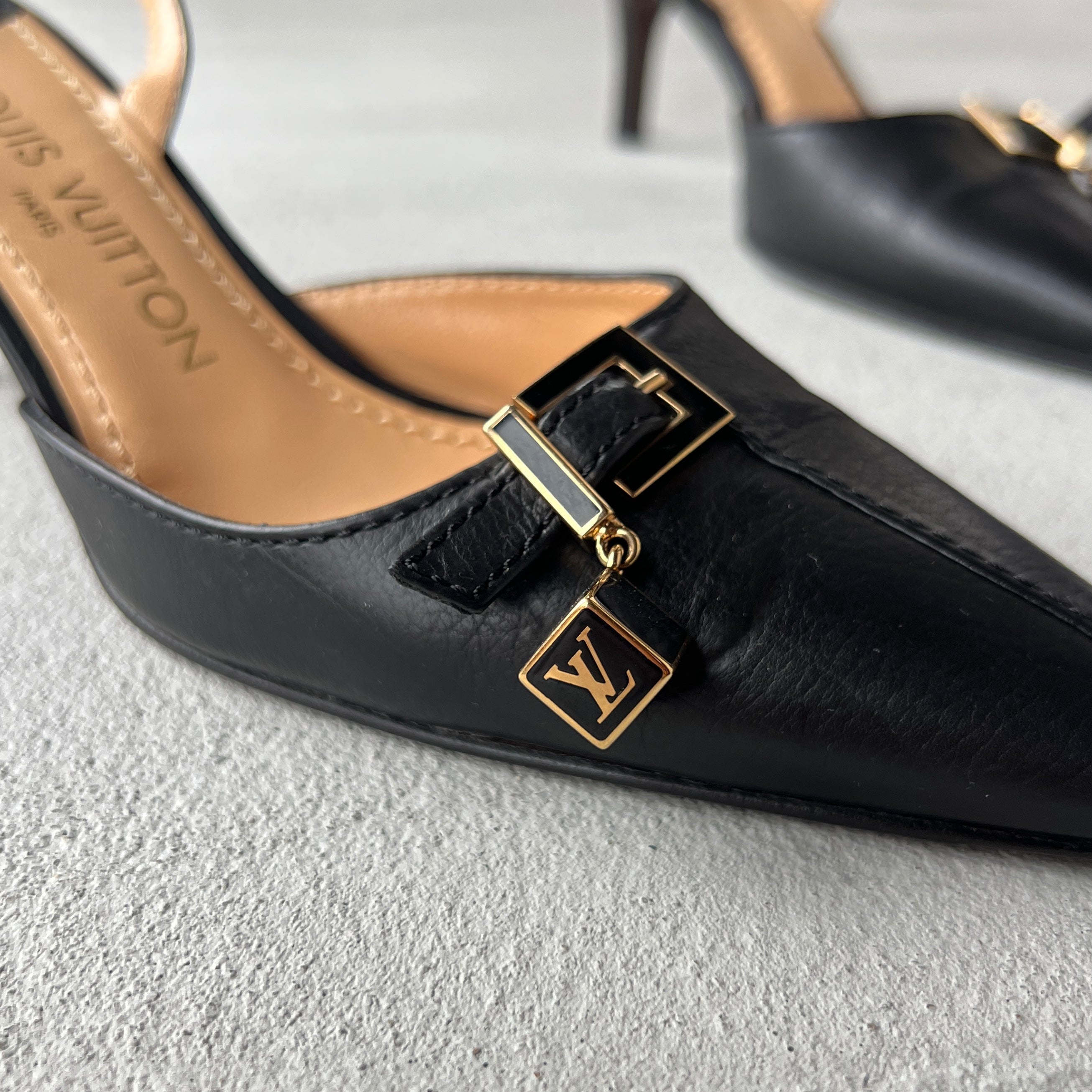 Louis Vuitton | Black Leather Logo Cube Buckle Pointed Toe Slingback Heels (39)
