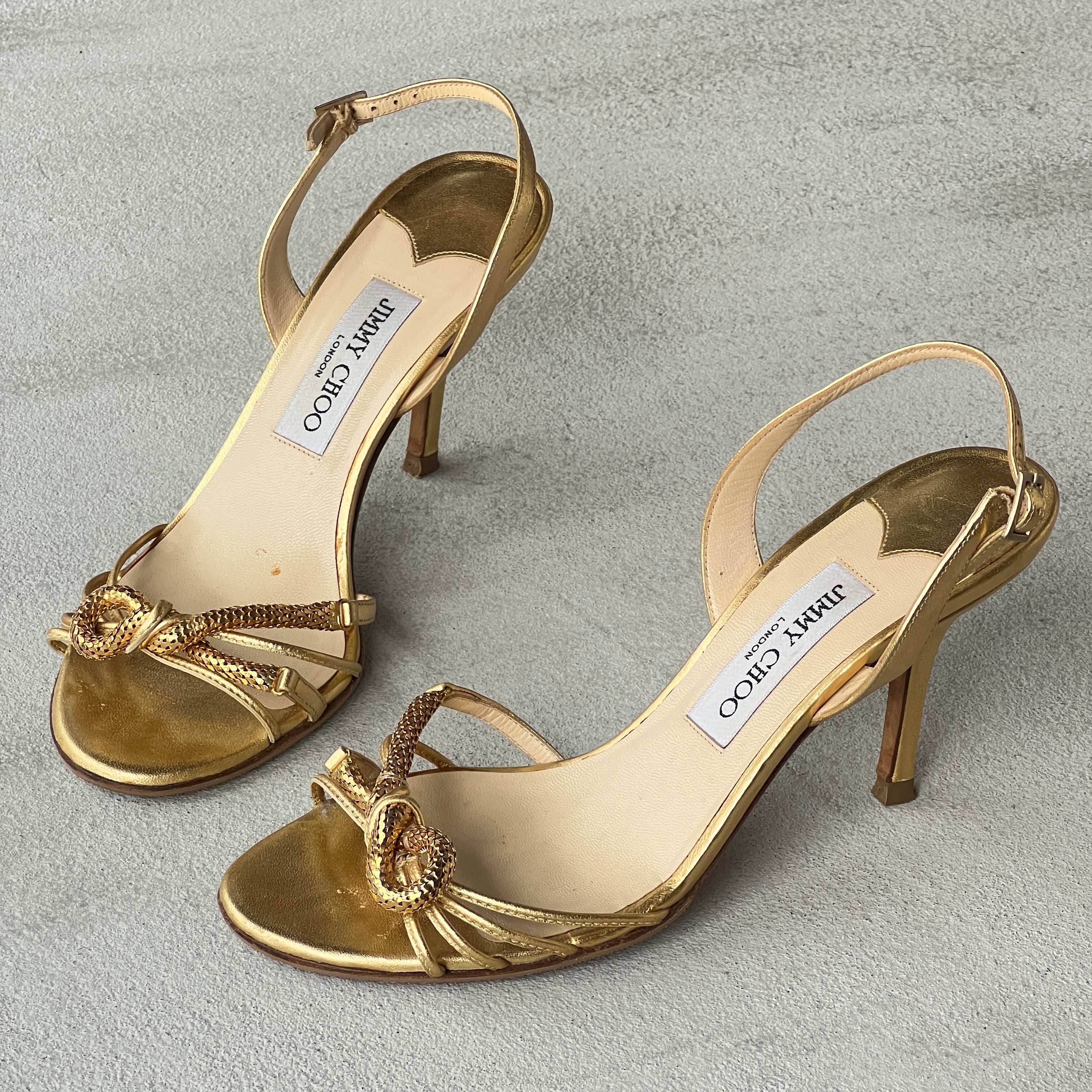 Jimmy Choo | Metallic Gold Leather Metal Knot Slingback Stiletto Heels (37.5)