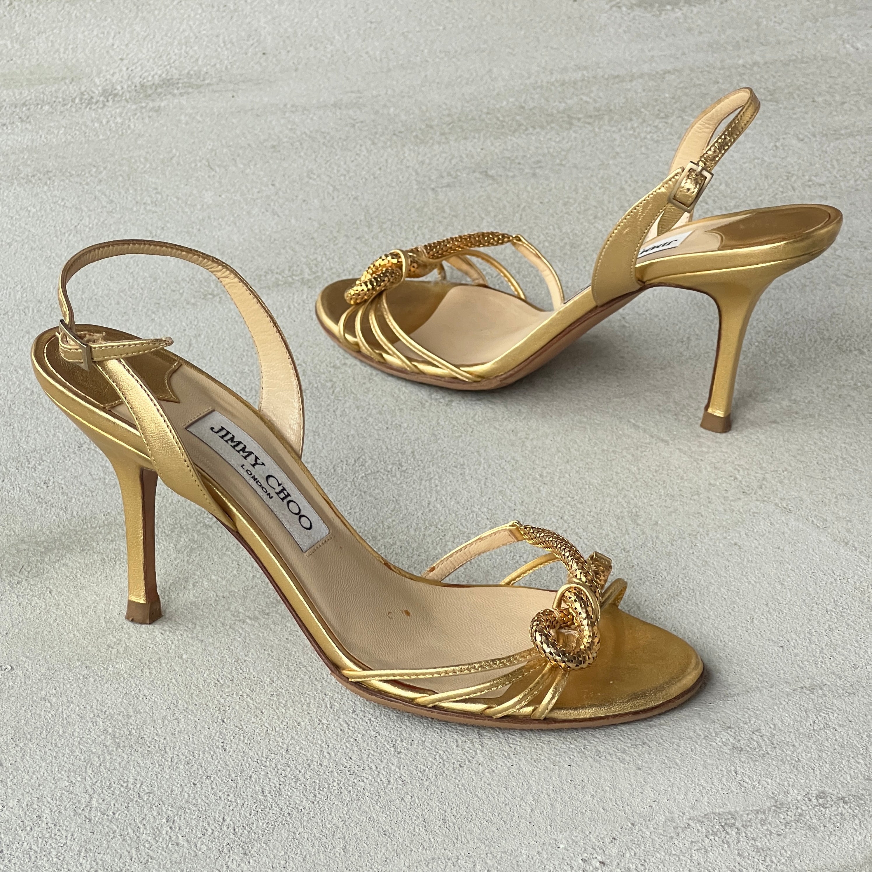 Jimmy Choo | Metallic Gold Leather Metal Knot Slingback Stiletto Heels (37.5)
