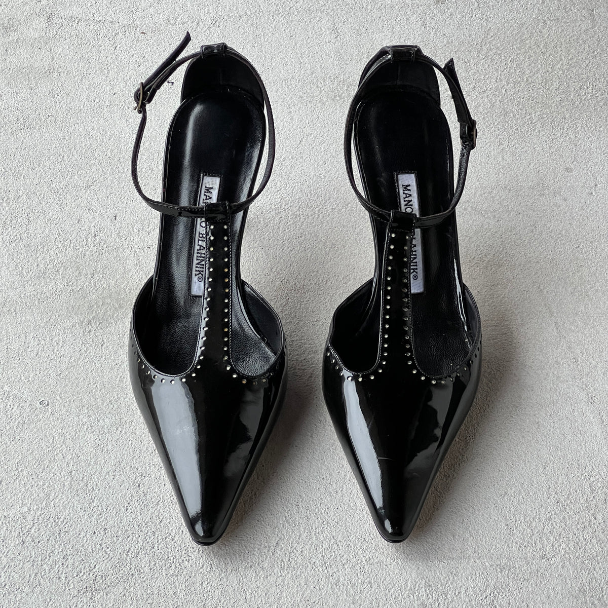 Manolo Blahnik | Black Patent Leather T-Strap Pointed Toe Pump (39)