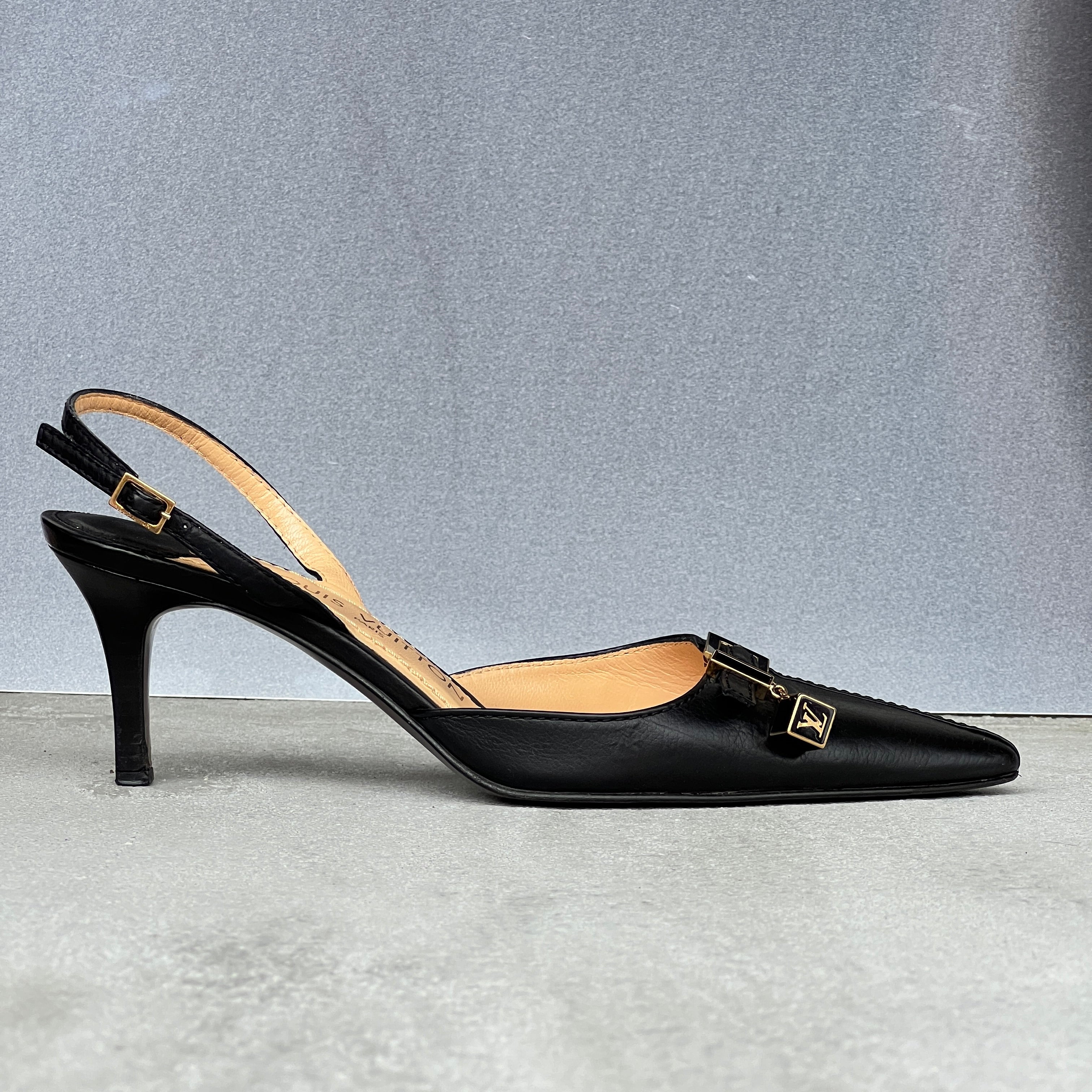 Louis Vuitton | Black Leather Logo Cube Buckle Pointed Toe Slingback Heels (39)