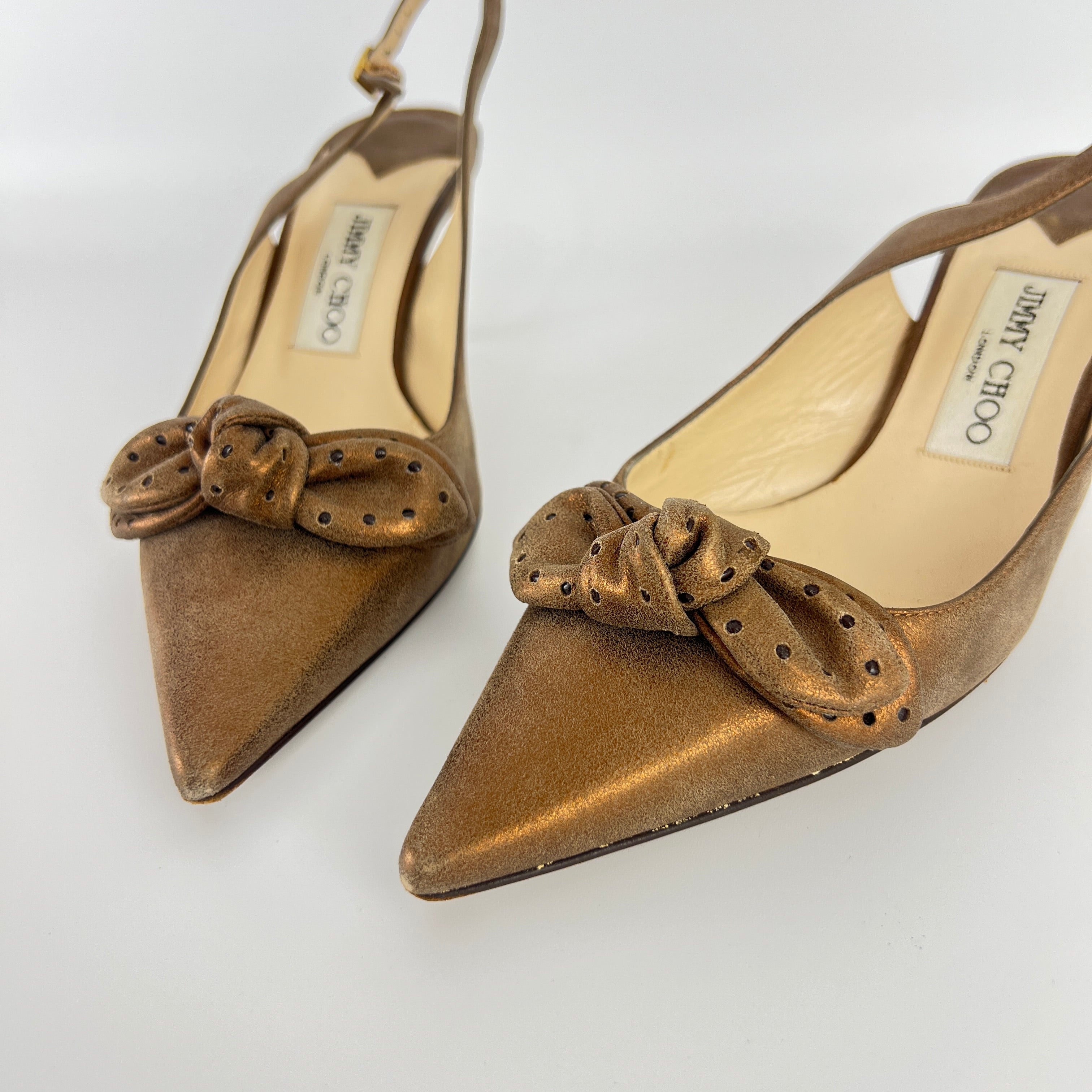 Jimmy Choo | Metallic Gold Bronze Leather Bow Slingback Stiletto Heels (37.5)