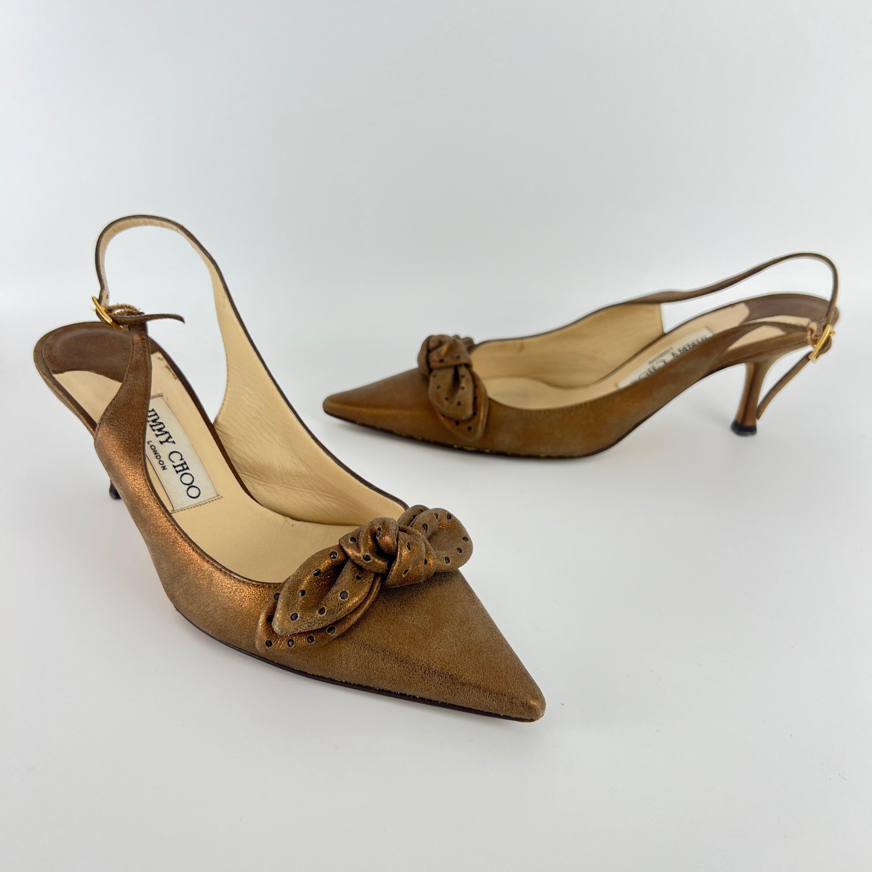 Jimmy Choo | Metallic Gold Bronze Leather Bow Slingback Stiletto Heels (37.5)