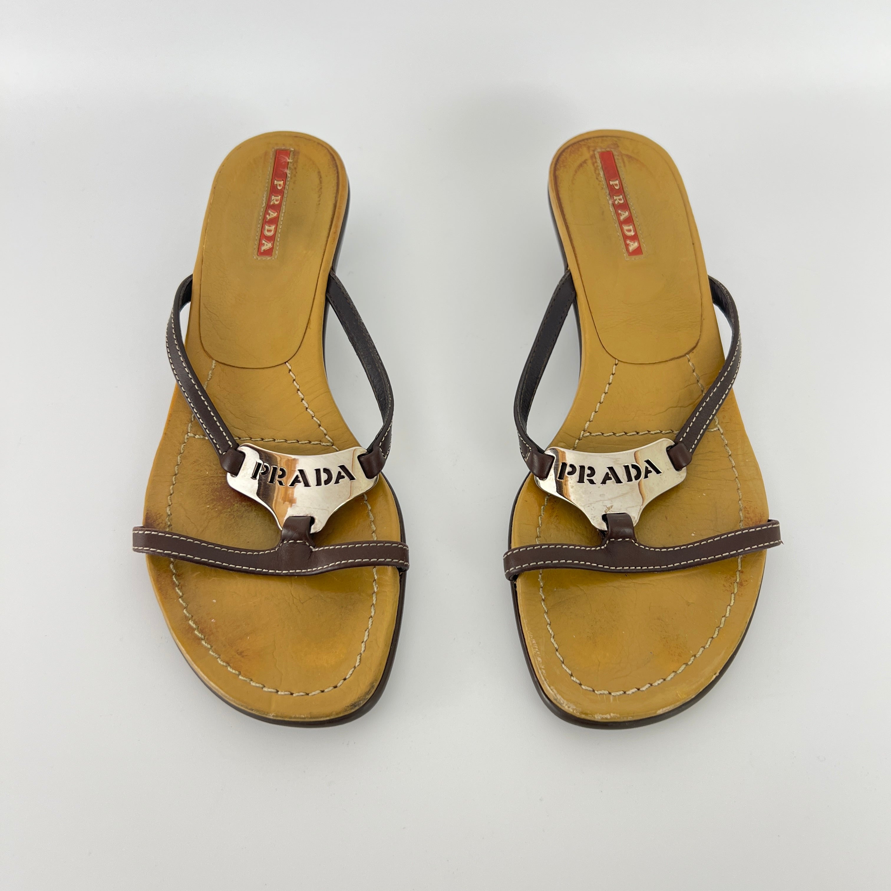 Prada | Brown Leather Silver Logo Buckle Kitten Sandal Heels (34.5)