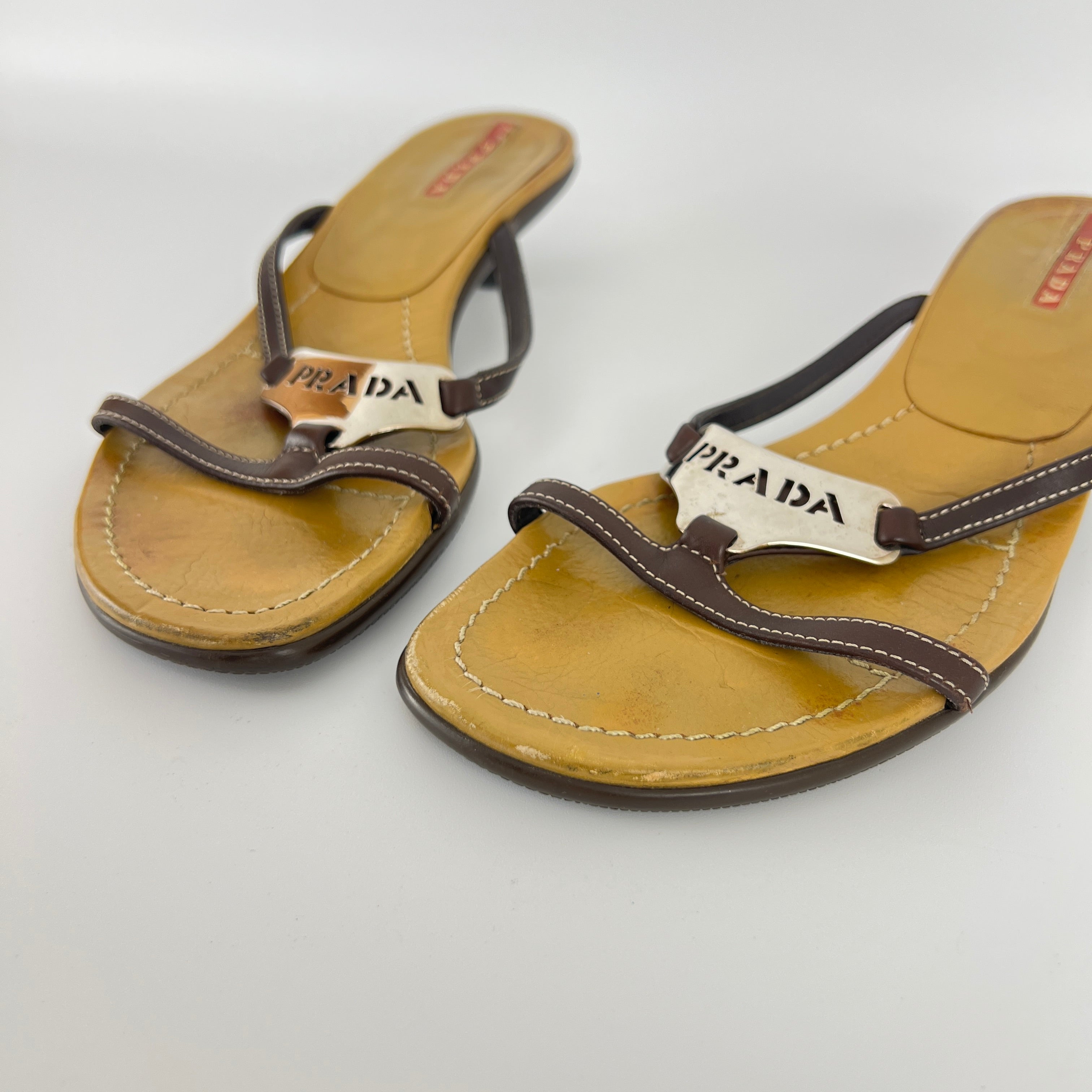 Prada | Brown Leather Silver Logo Buckle Kitten Sandal Heels (34.5)