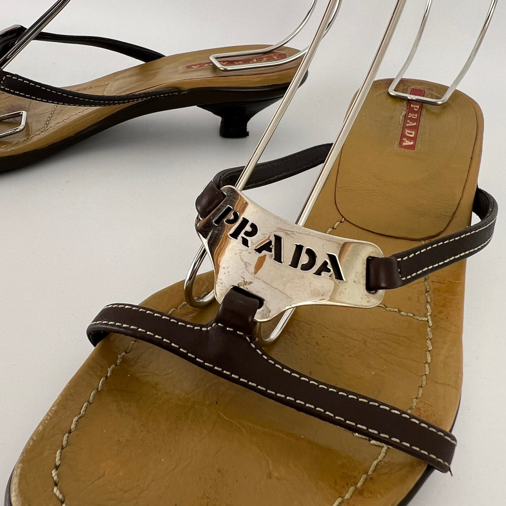 Prada | Brown Leather Silver Logo Buckle Kitten Sandal Heels (34.5)