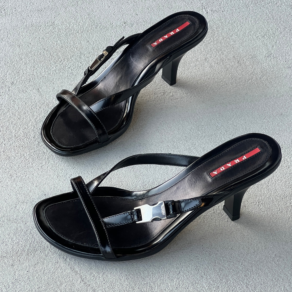 Prada | Vintage 2000s Black Leather Silver Logo Buckle Kitten Heel Mules (36.5)