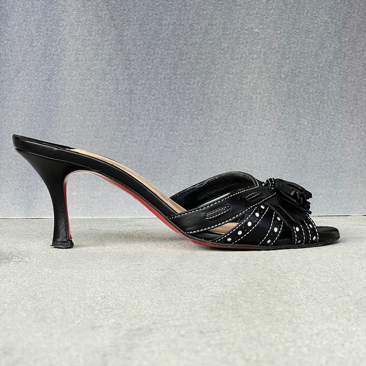 Louboutin | Black Leather Brogue Tassel Slide Mule (34)