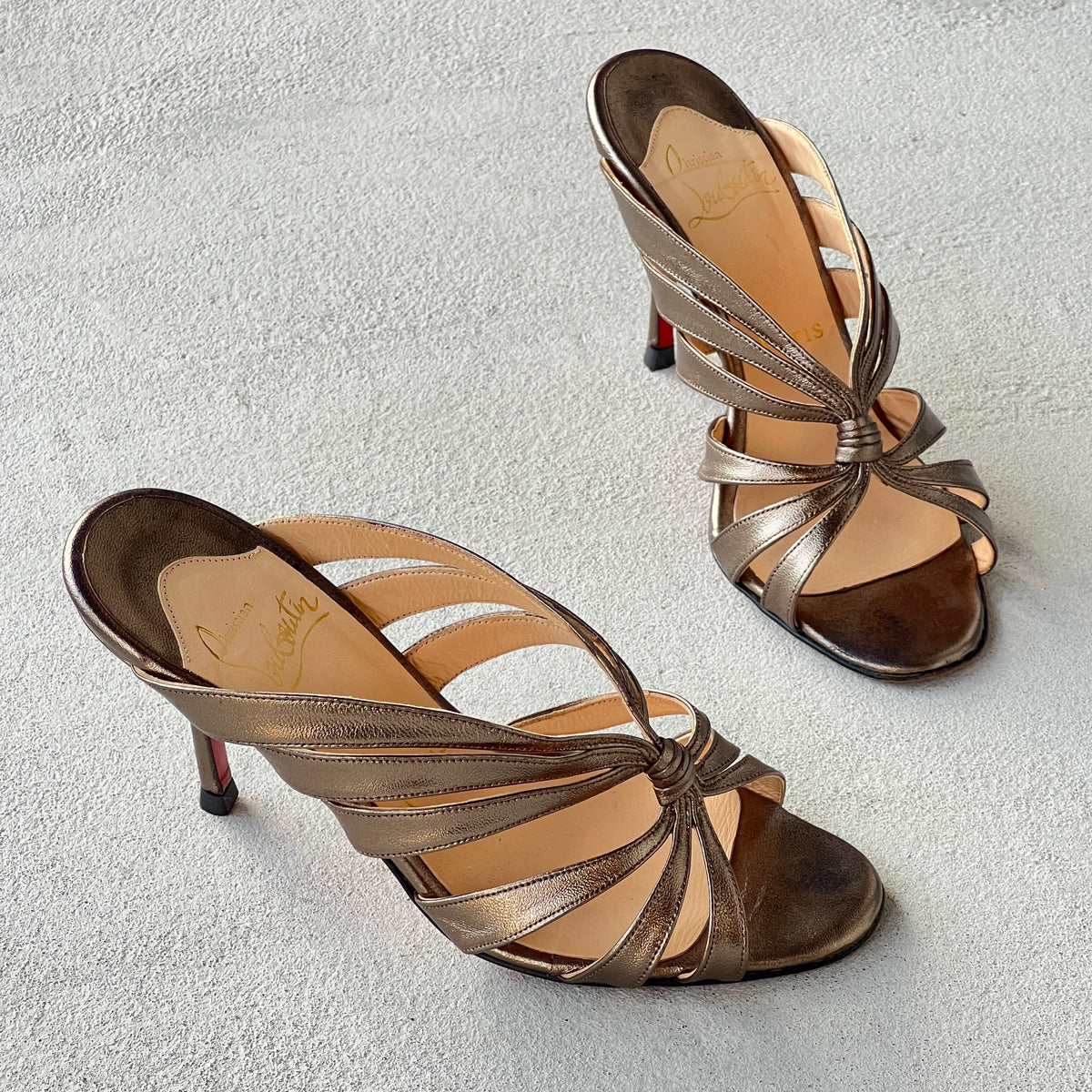 Louboutin | Mulegrace Rose Gold Metallic Leather Twist Strappy Sandal Mule Heels (36)