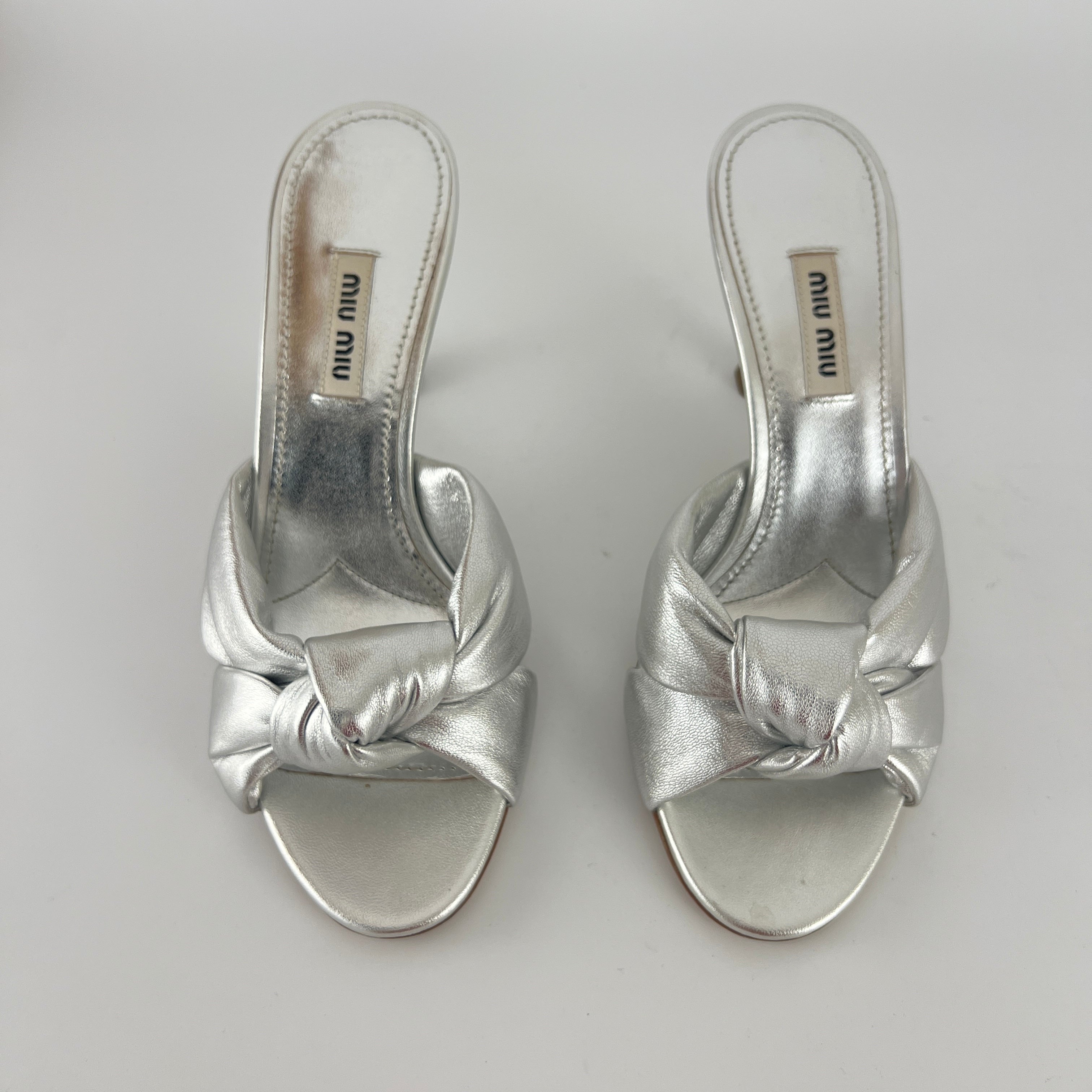 Miu Miu | Metallic Silver Leather Knot Metal Heel Slide Mules (37)