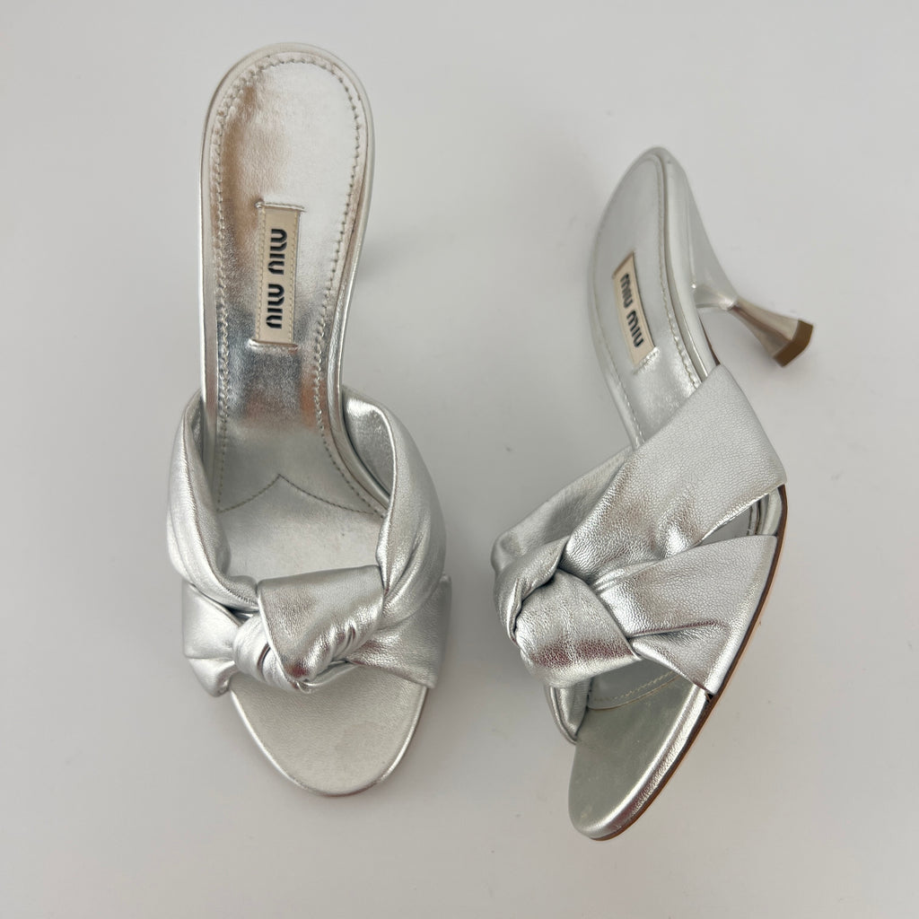 Miu Miu | Metallic Silver Leather Knot Metal Heel Slide Mules (37)