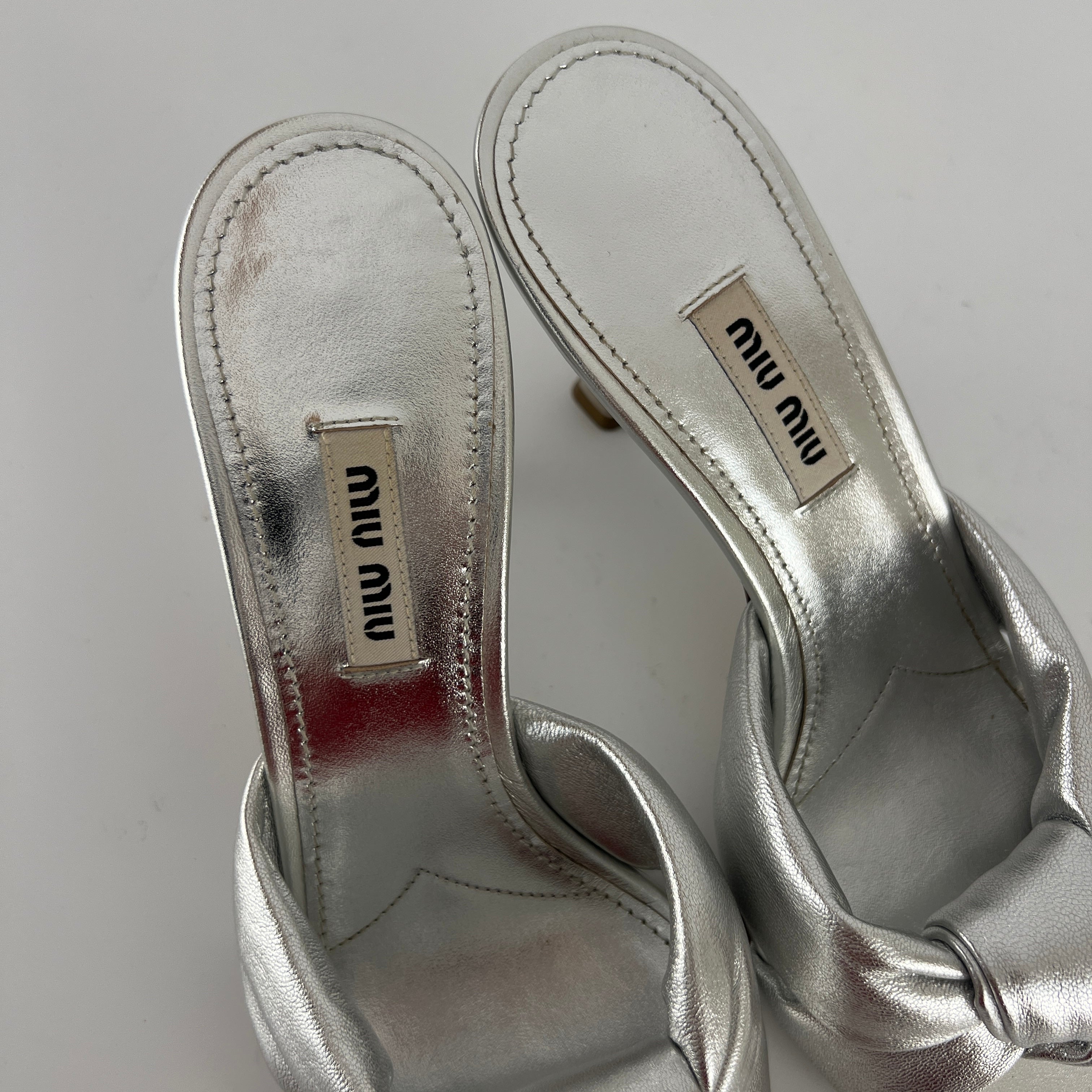 Miu Miu | Metallic Silver Leather Knot Metal Heel Slide Mules (37)