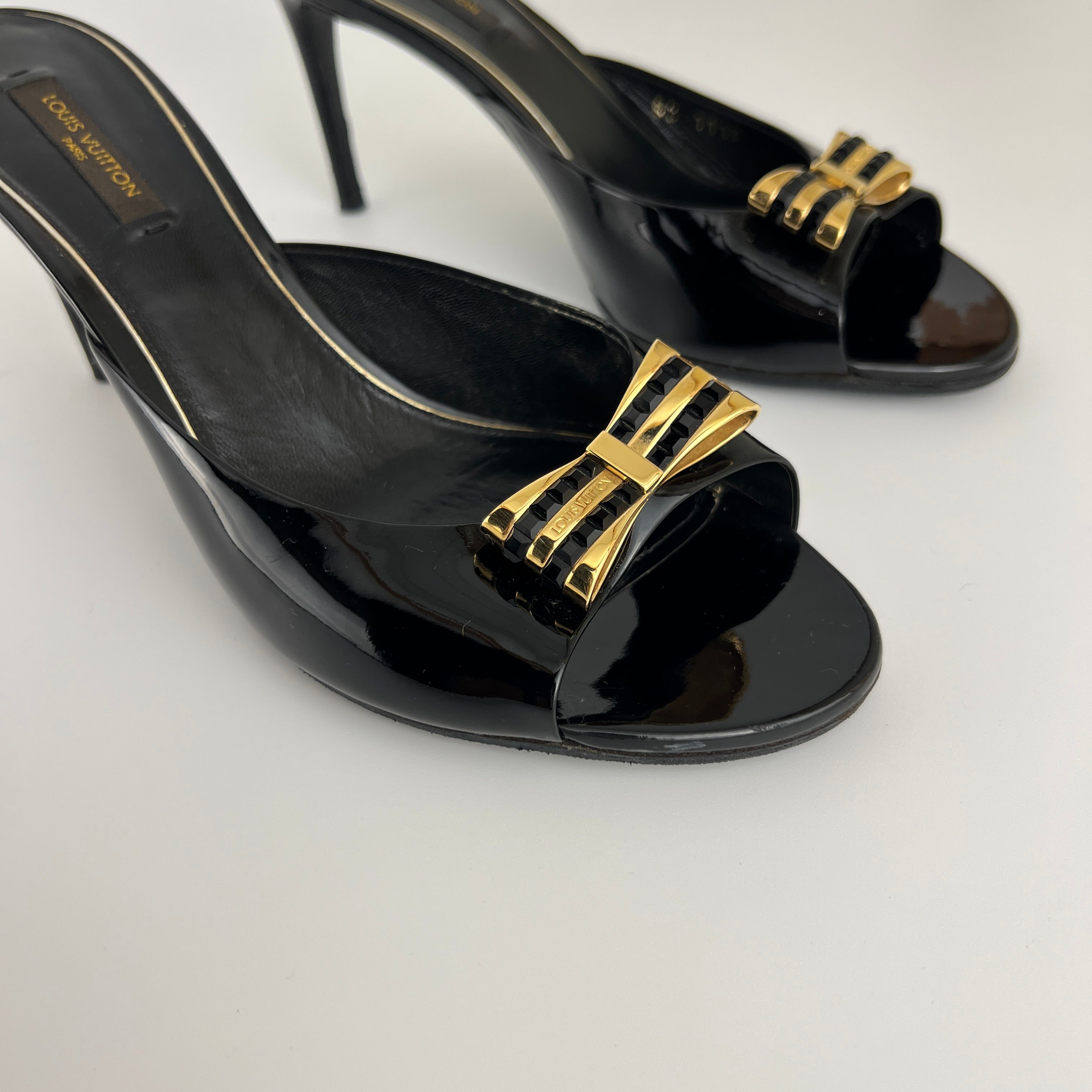 Louis Vuitton | Black Patent Leather Gold Gem Metal Bow Slide Mules (38)