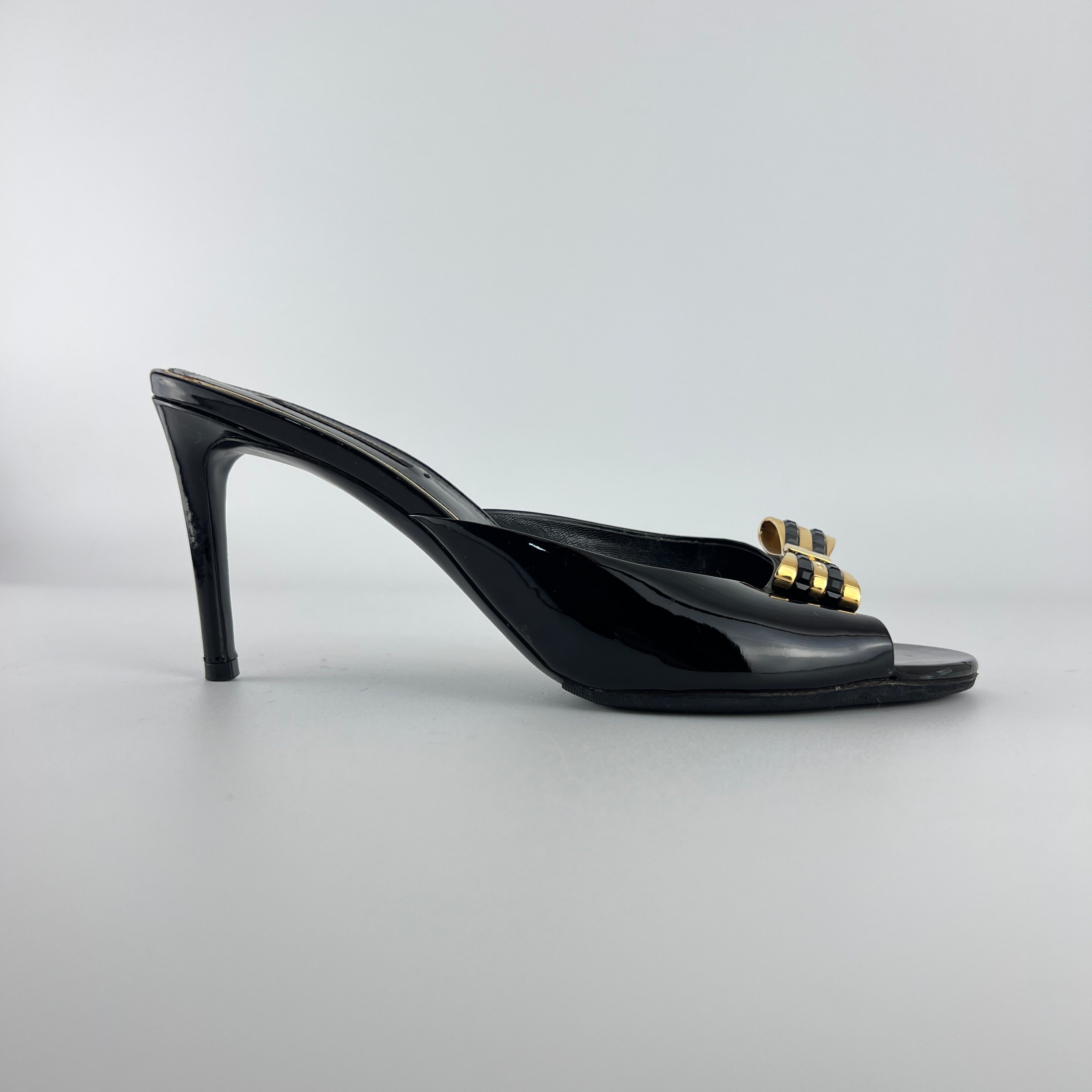 Louis Vuitton | Black Patent Leather Gold Gem Metal Bow Slide Mules (38)