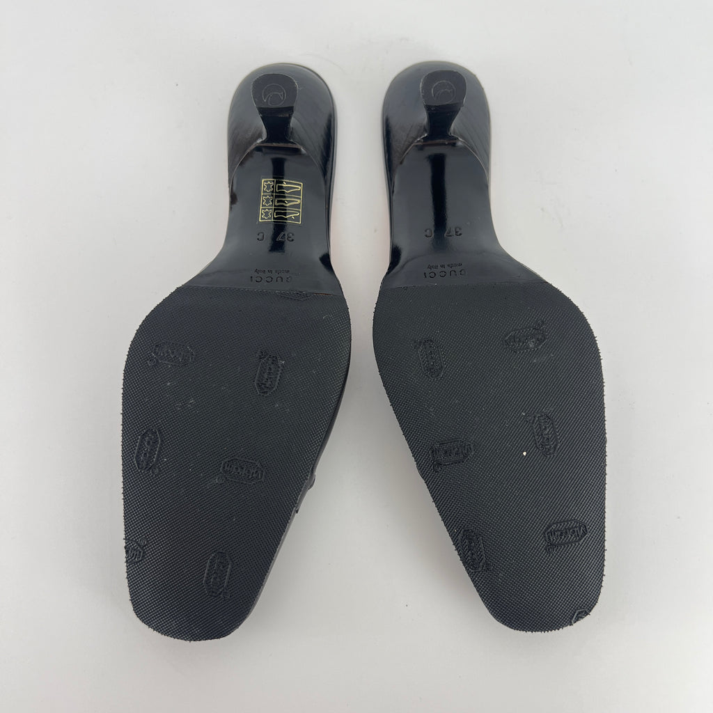 Gucci | Black Leather Closed Toe Brogue Tassel Orange Insole Mules (37C)