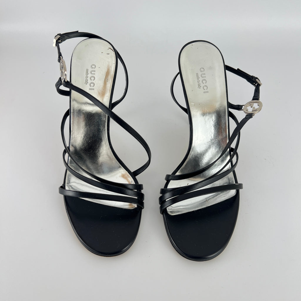 Gucci | GG Logo Silver Hardware Black Leather Metallic Insole Strappy Heels (37.5)