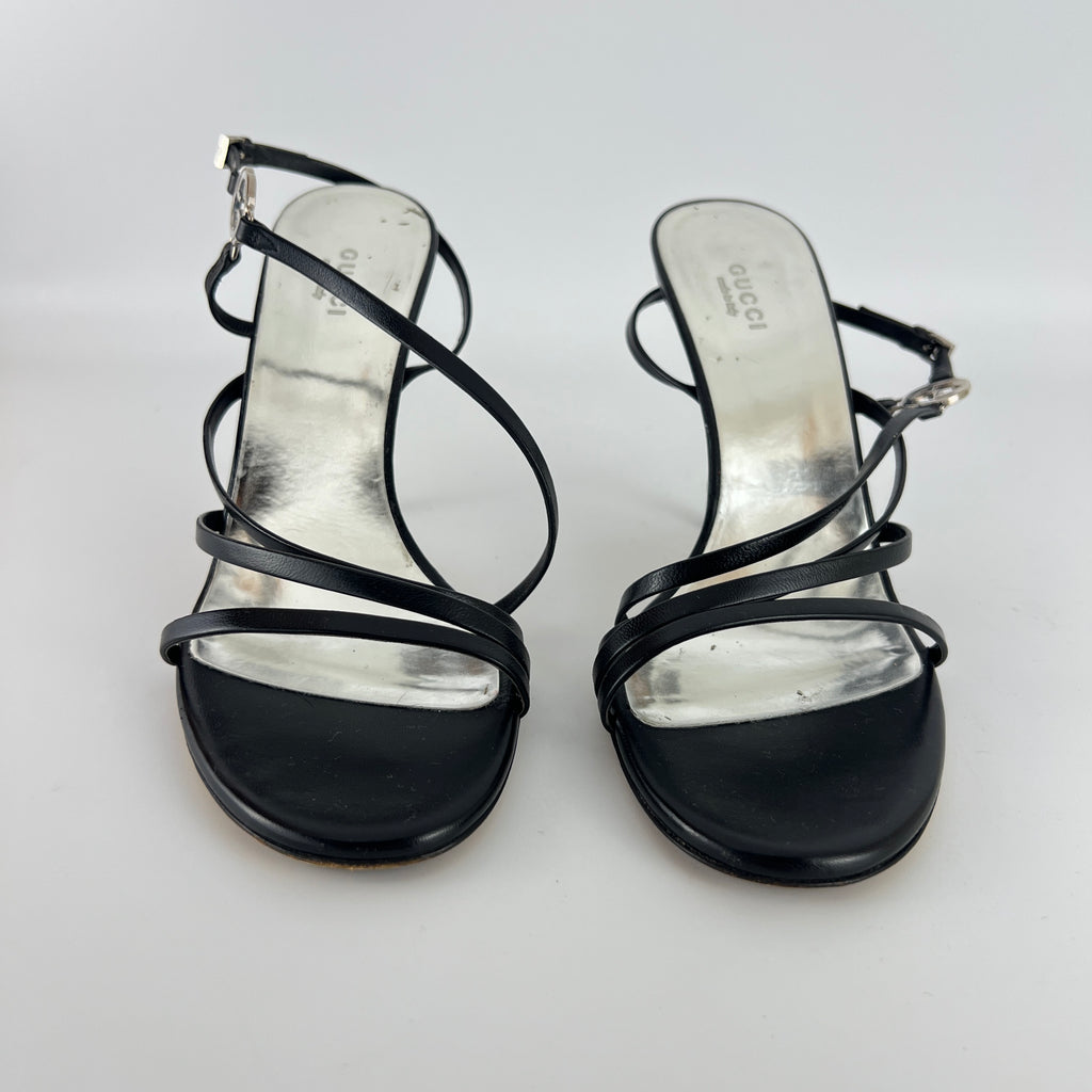 Gucci | GG Logo Silver Hardware Black Leather Metallic Insole Strappy Heels (37.5)
