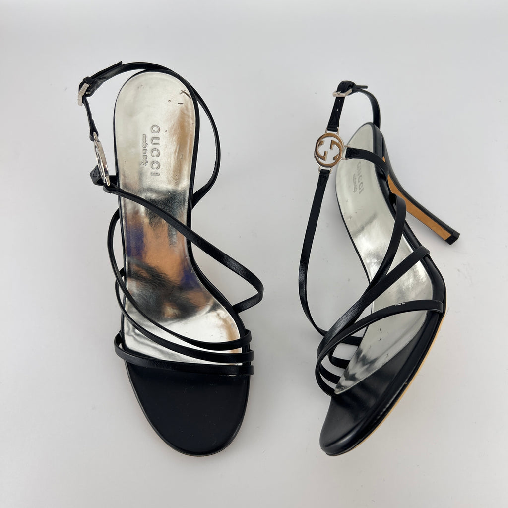 Gucci | GG Logo Silver Hardware Black Leather Metallic Insole Strappy Heels (37.5)