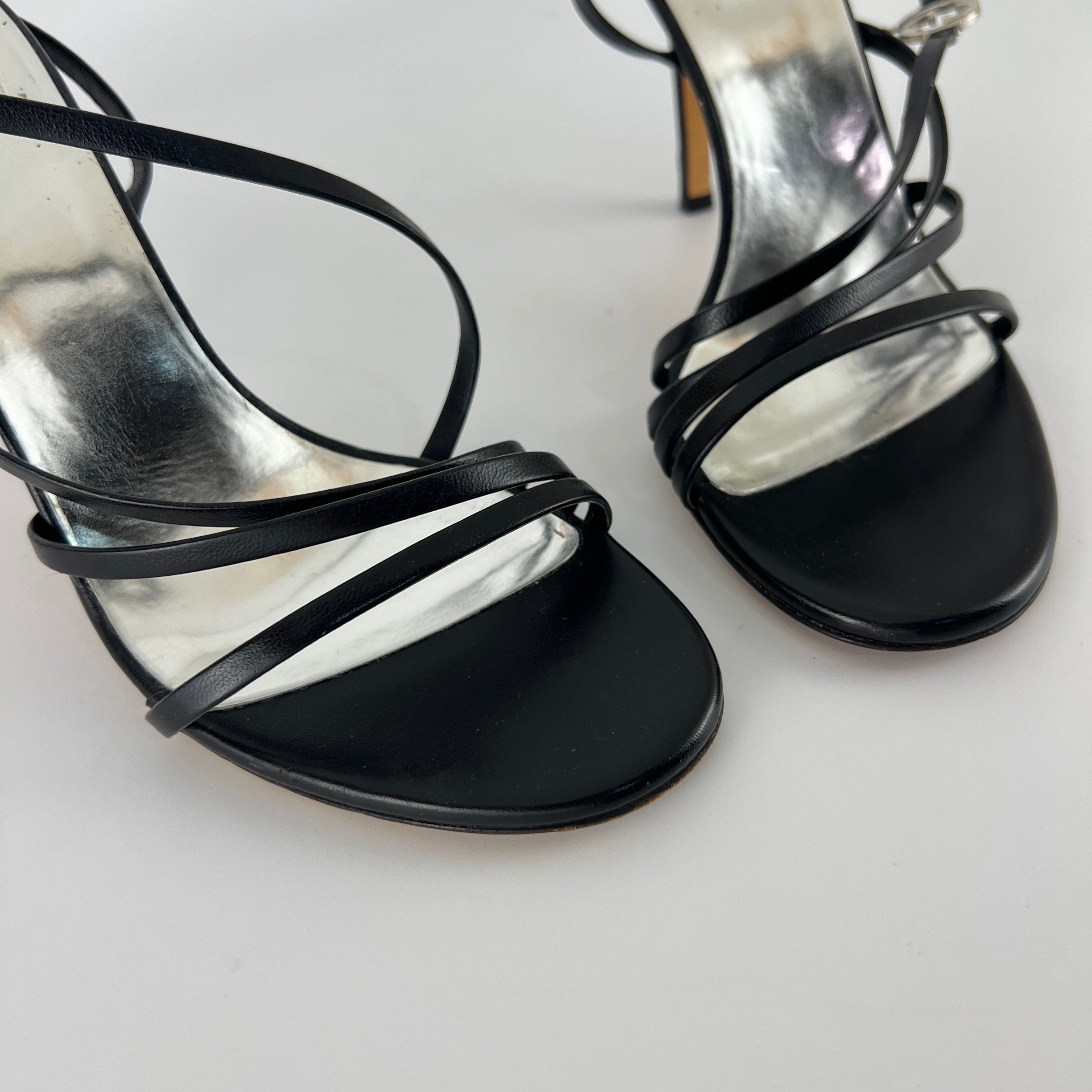 Gucci | GG Logo Silver Hardware Black Leather Metallic Insole Strappy Heels (37.5)