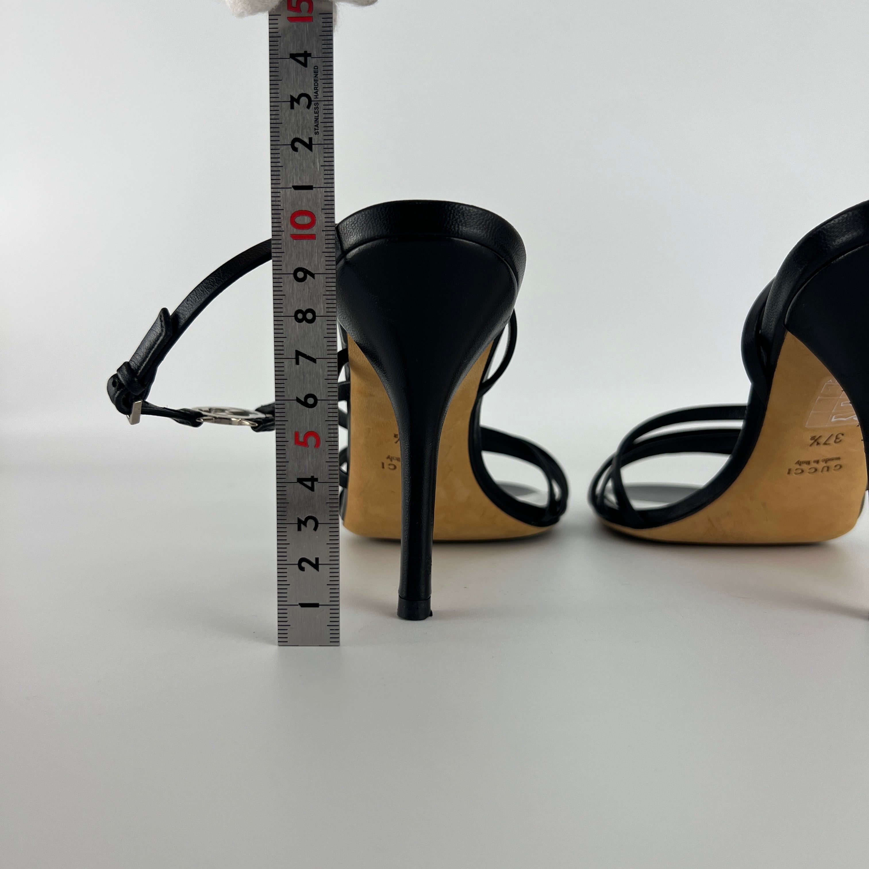 Gucci | GG Logo Silver Hardware Black Leather Metallic Insole Strappy Heels (37.5)