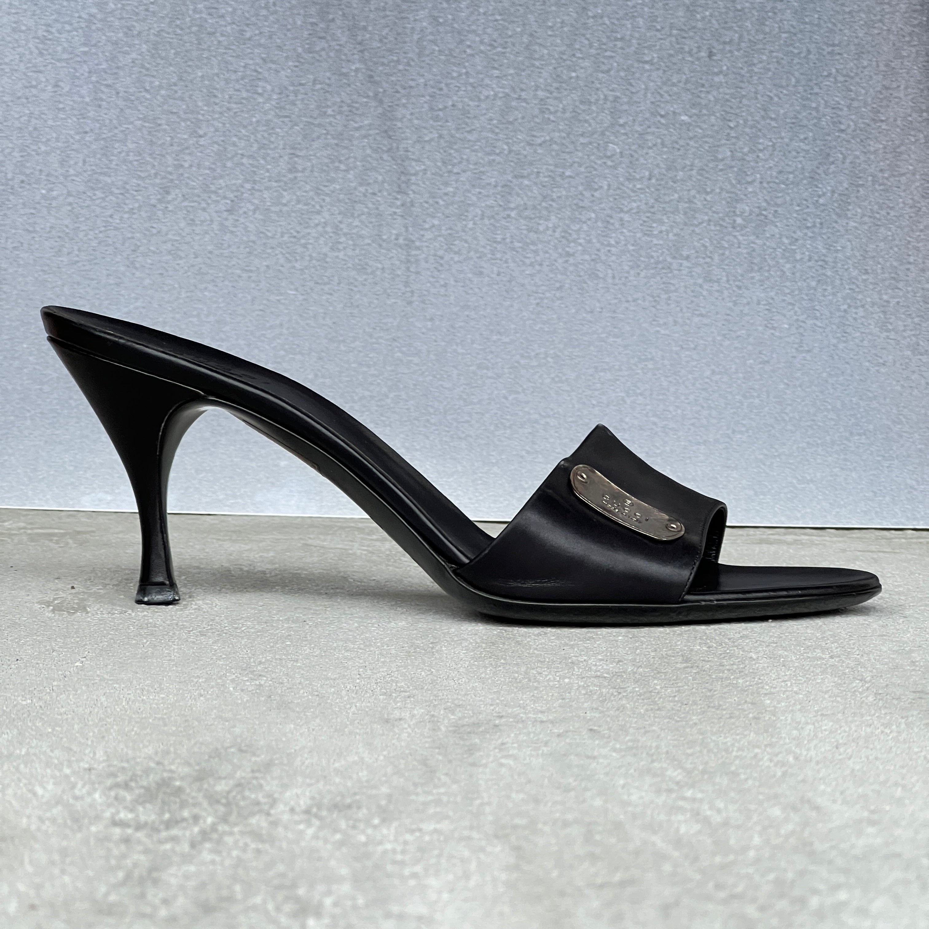 Gucci | Vintage Black Leather Silver Logo Dog Tag Slide Mules (37.5)