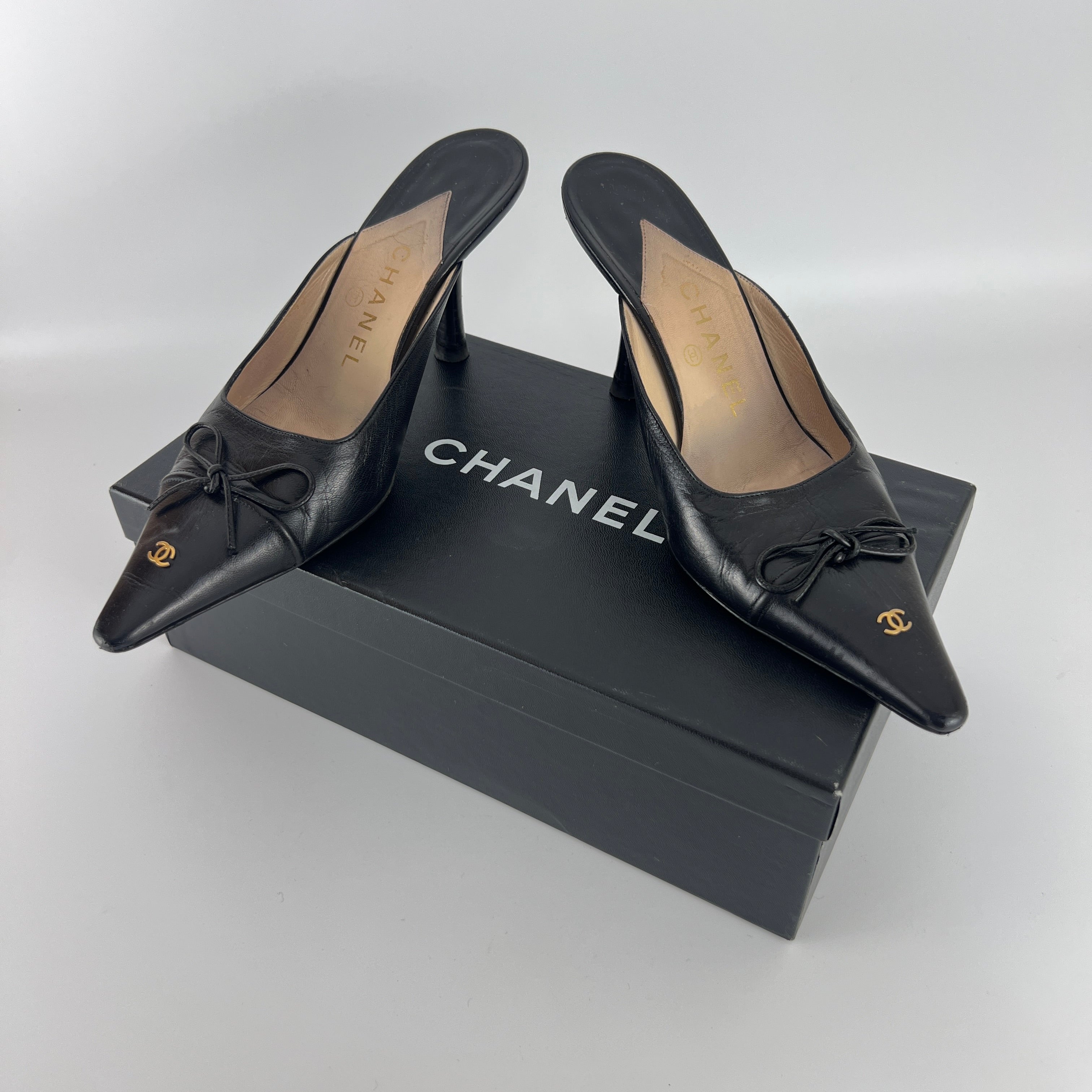 Chanel | Vintage Black Leather CC Logo Bow Pointed Toe Slide Mules (37.5)