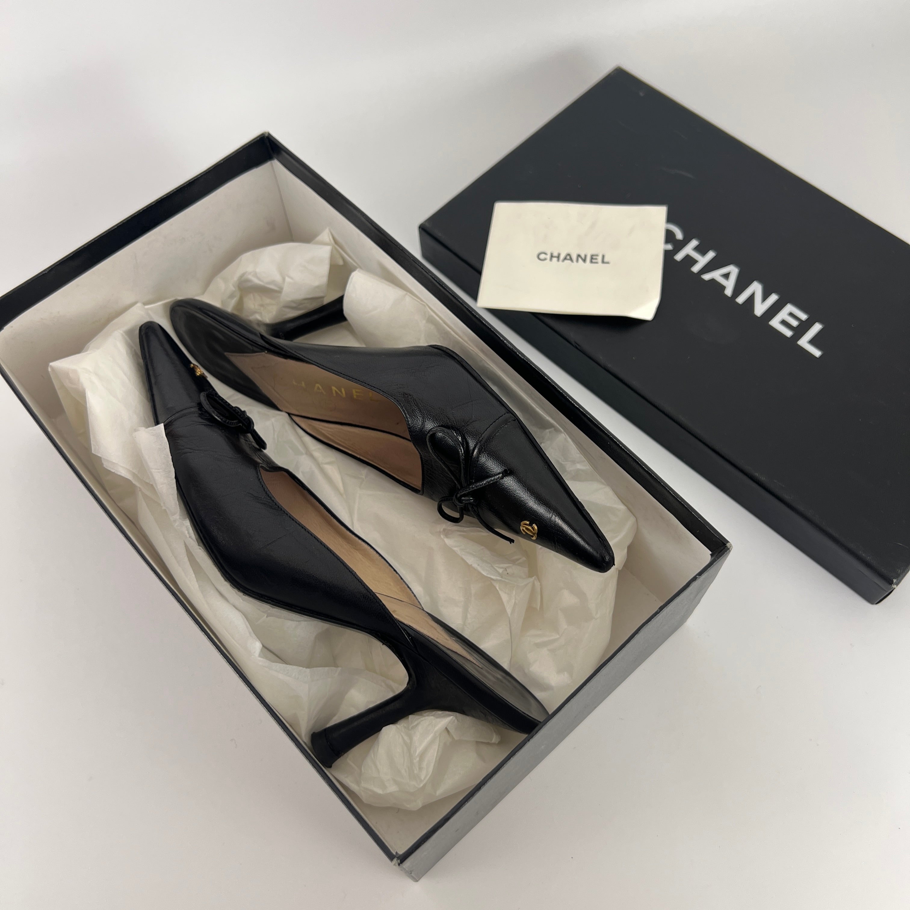 Chanel | Vintage Black Leather CC Logo Bow Pointed Toe Slide Mules (37.5)