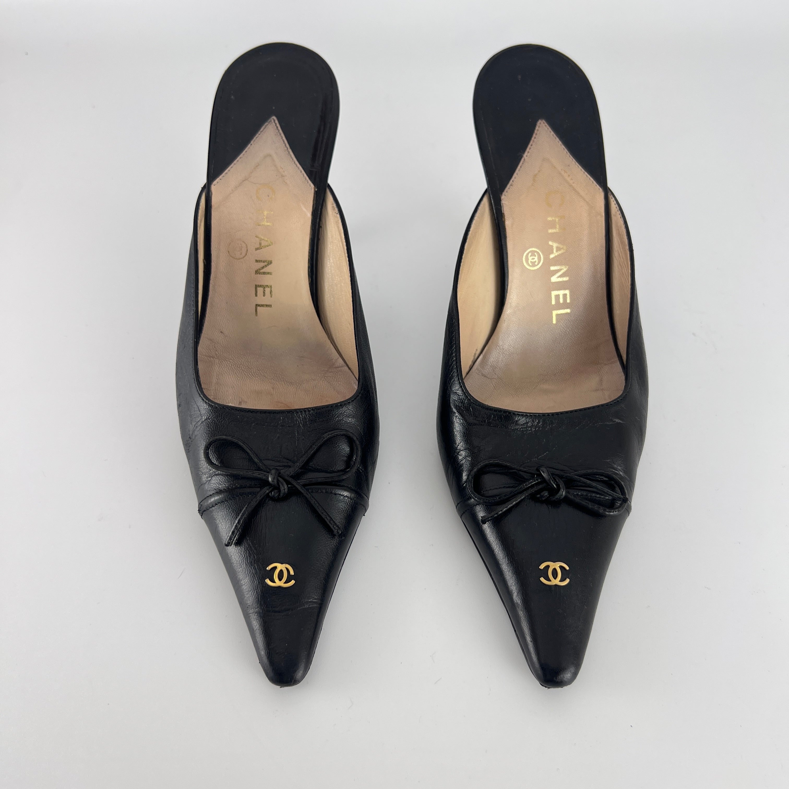 Chanel | Vintage Black Leather CC Logo Bow Pointed Toe Slide Mules (37.5)