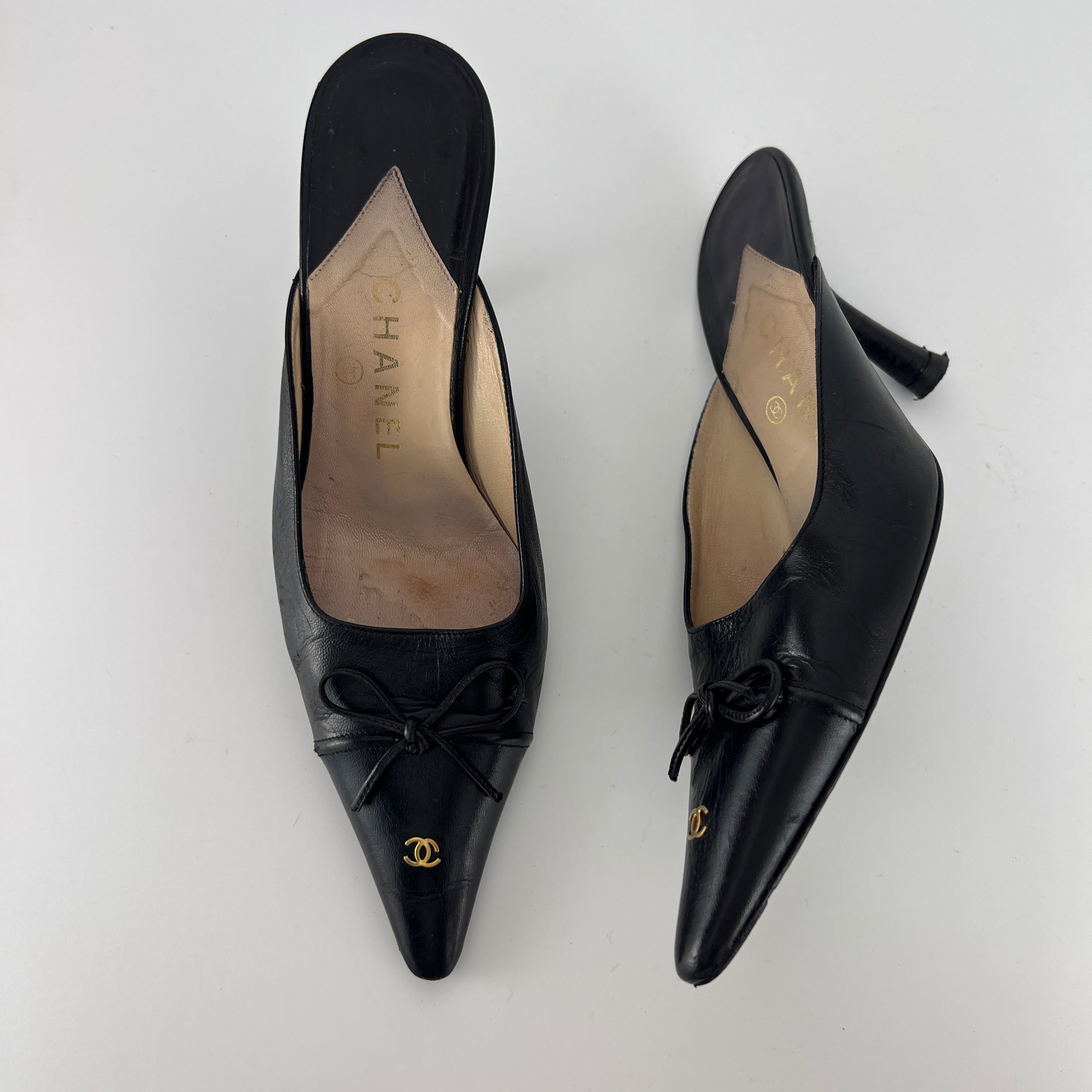 Chanel | Vintage Black Leather CC Logo Bow Pointed Toe Slide Mules (37.5)