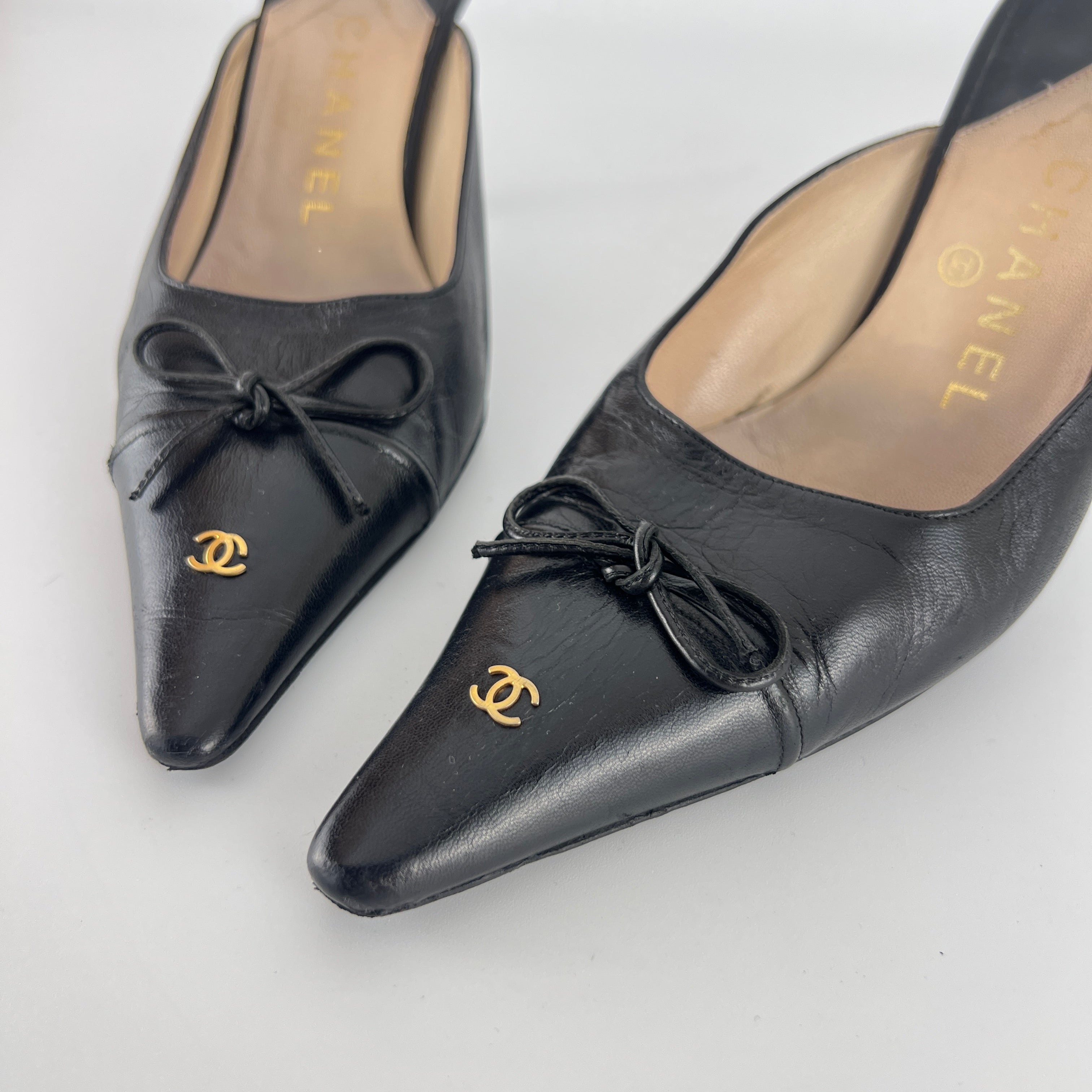 Chanel | Vintage Black Leather CC Logo Bow Pointed Toe Slide Mules (37.5)