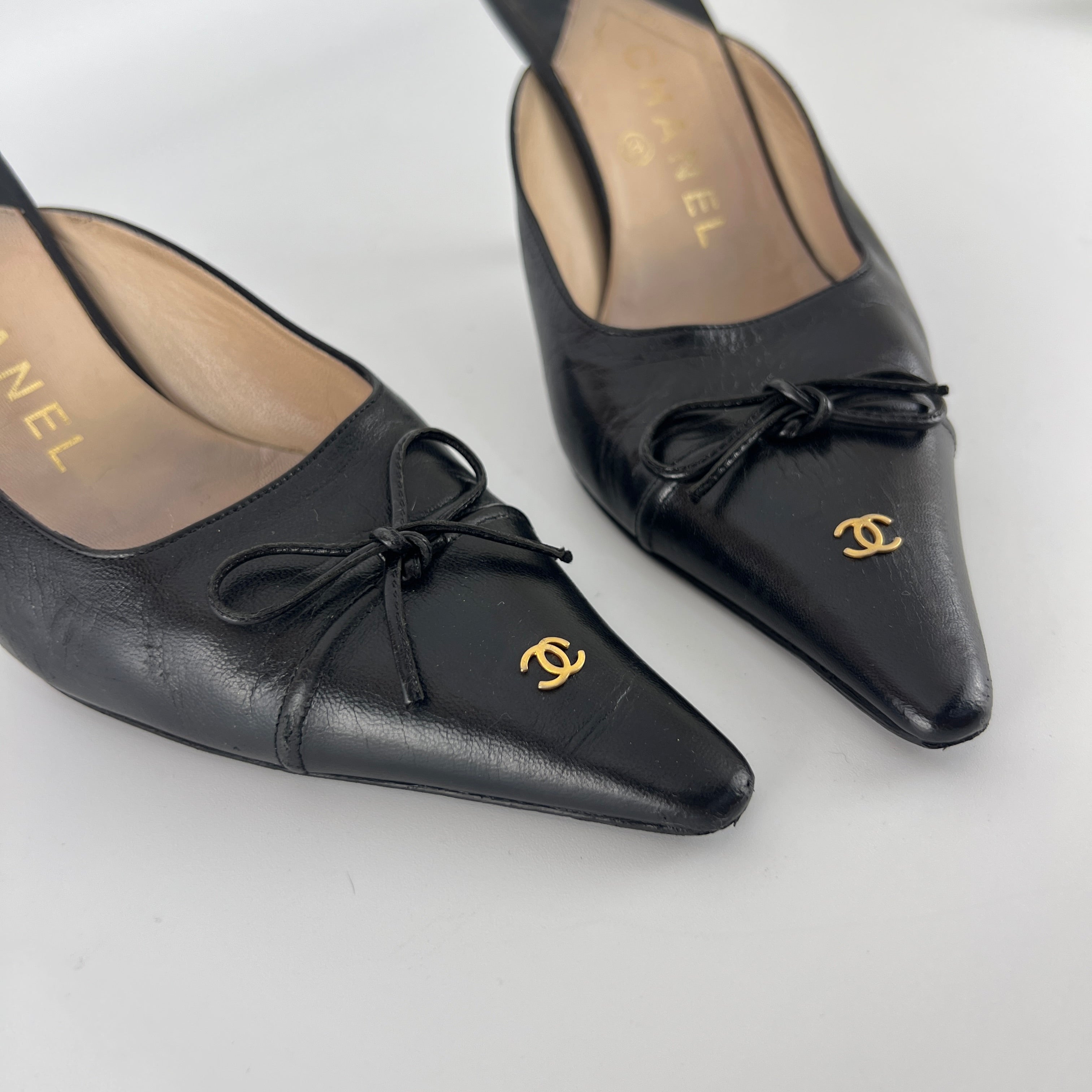 Chanel | Vintage Black Leather CC Logo Bow Pointed Toe Slide Mules (37.5)