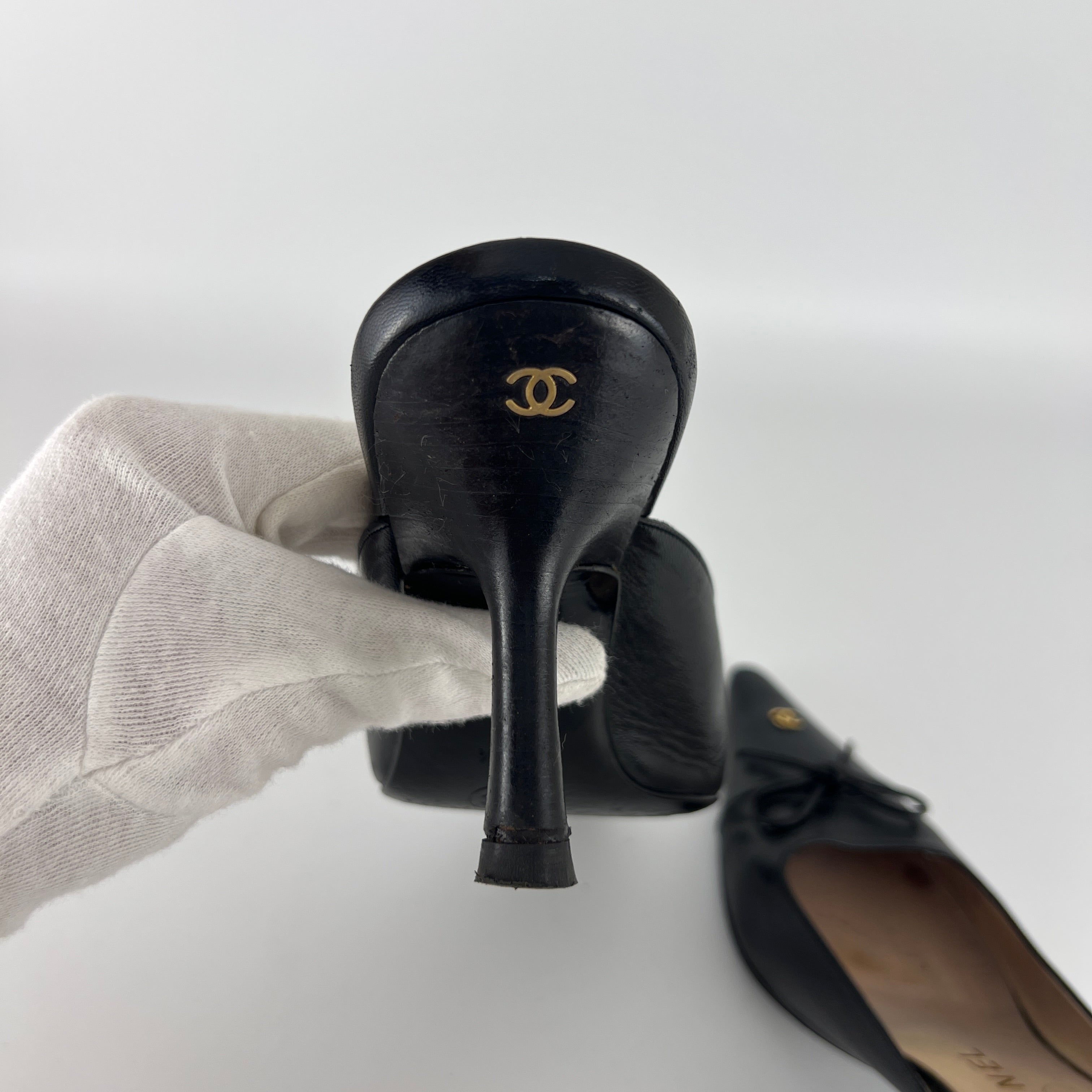 Chanel | Vintage Black Leather CC Logo Bow Pointed Toe Slide Mules (37.5)