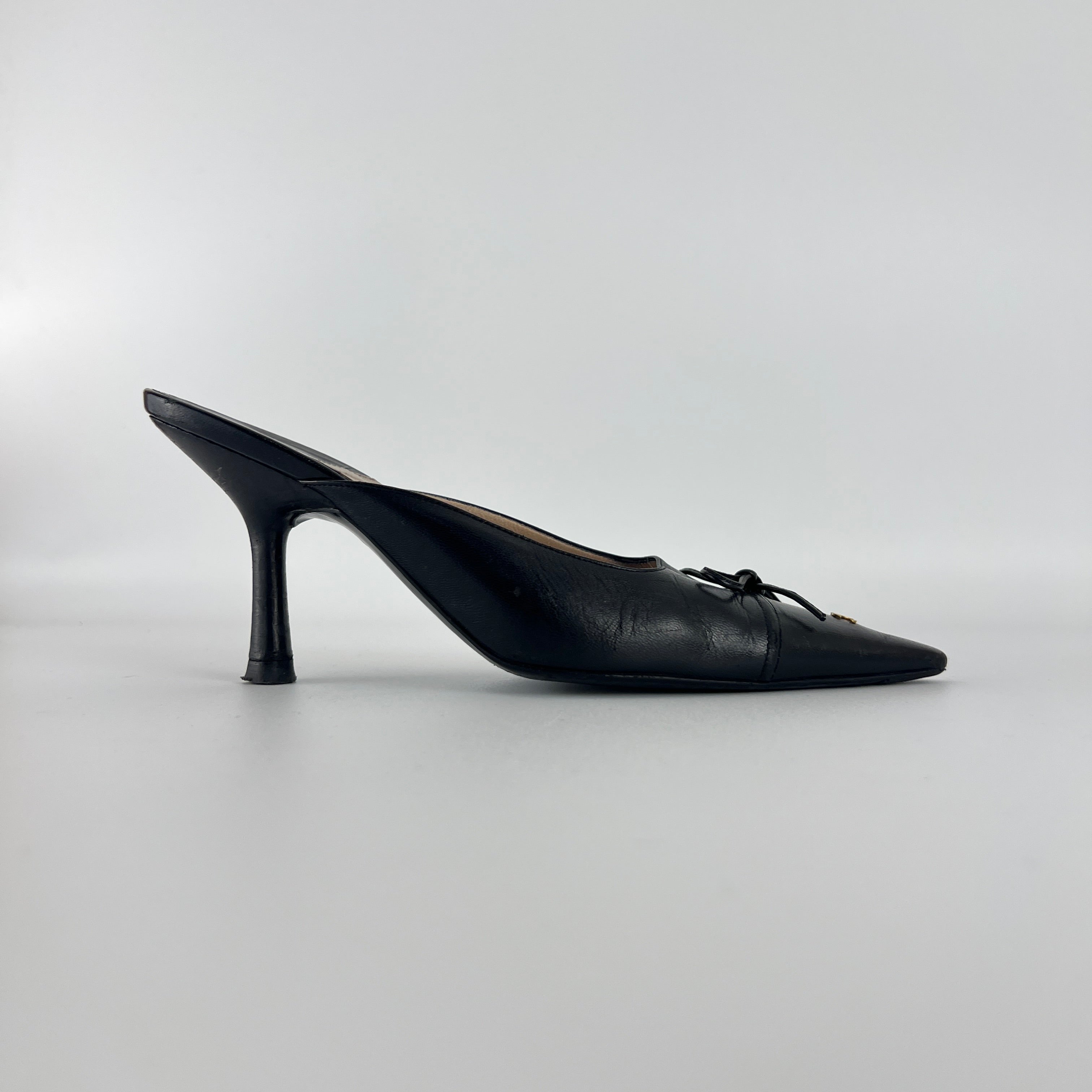Chanel | Vintage Black Leather CC Logo Bow Pointed Toe Slide Mules (37.5)