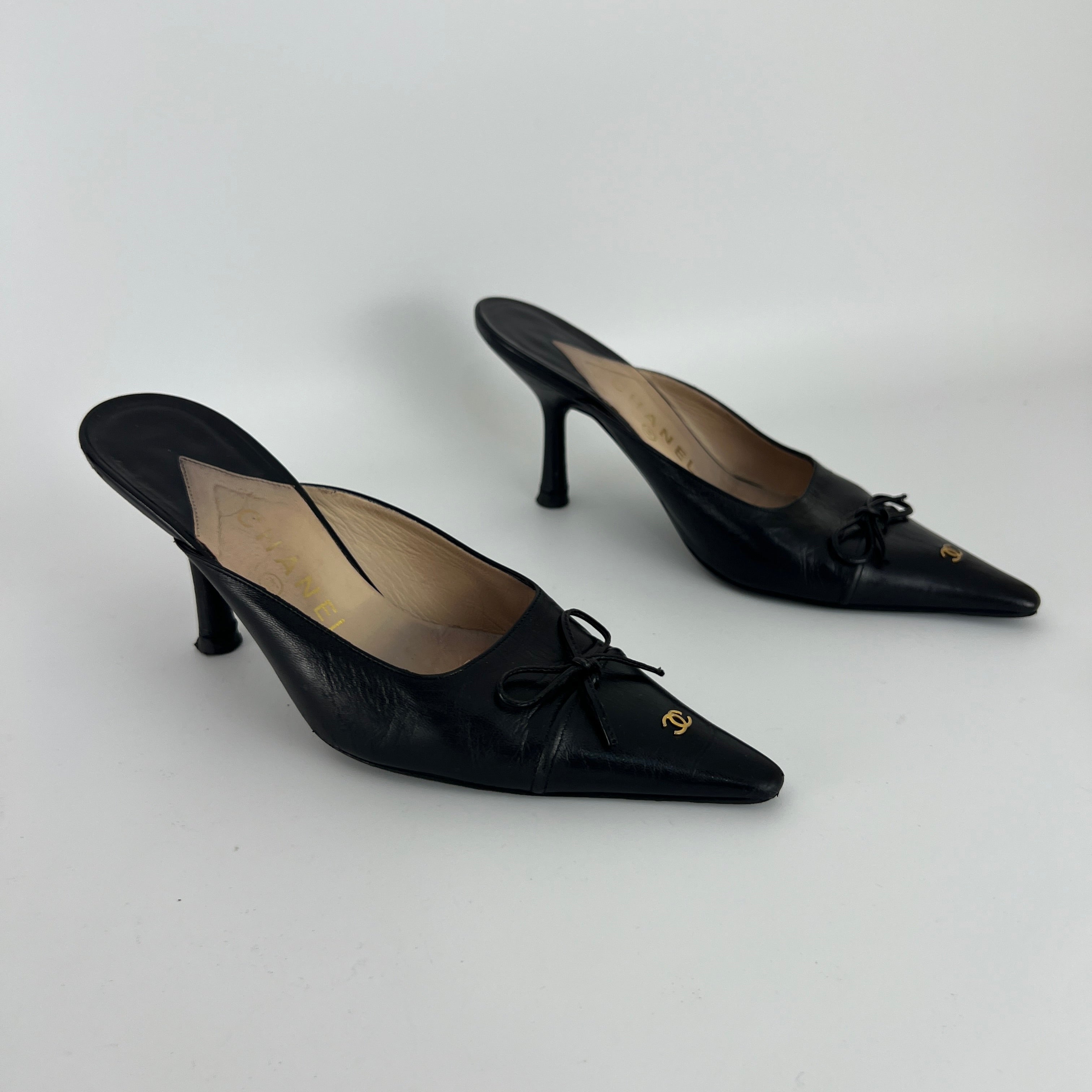 Chanel | Vintage Black Leather CC Logo Bow Pointed Toe Slide Mules (37.5)