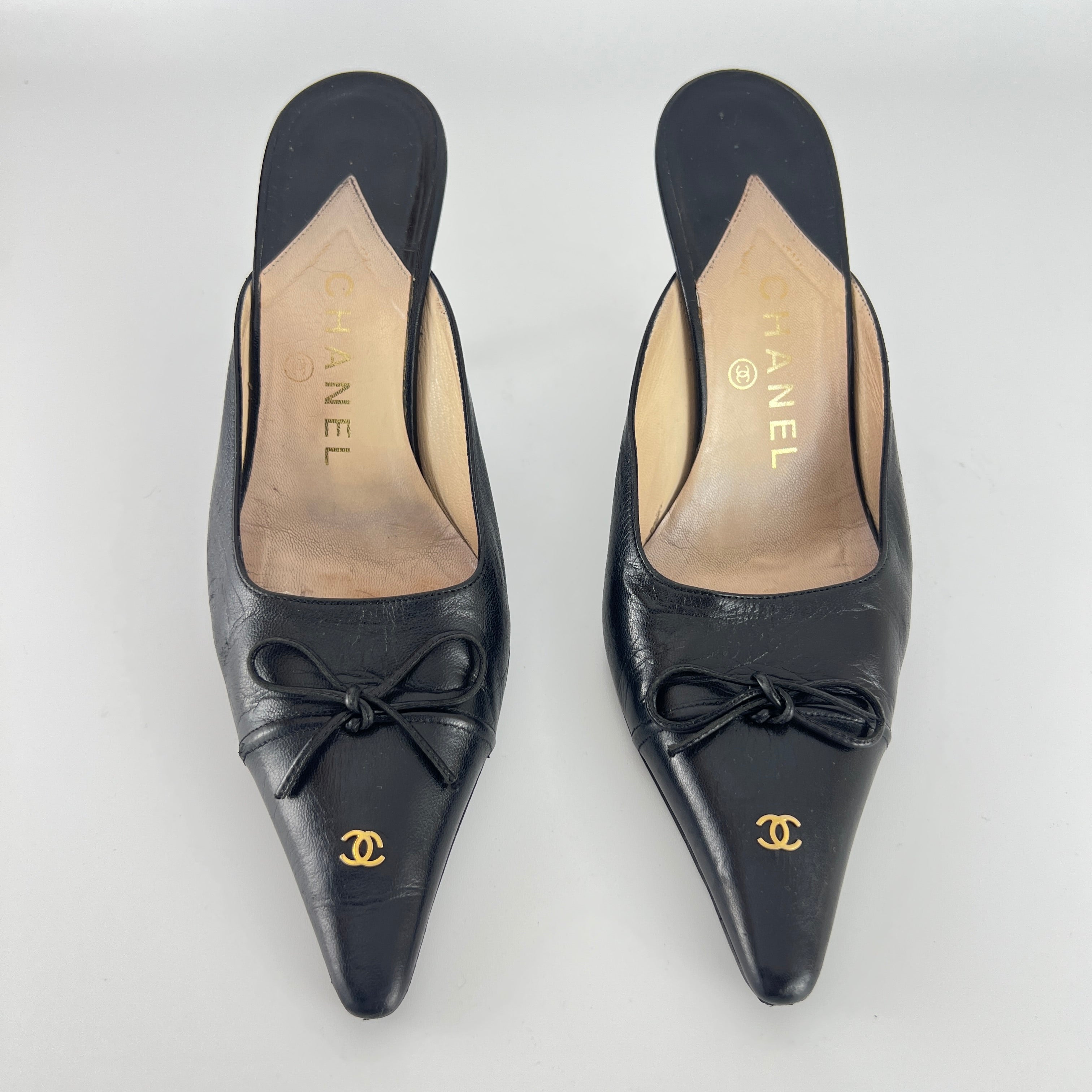 Chanel | Vintage Black Leather CC Logo Bow Pointed Toe Slide Mules (37.5)