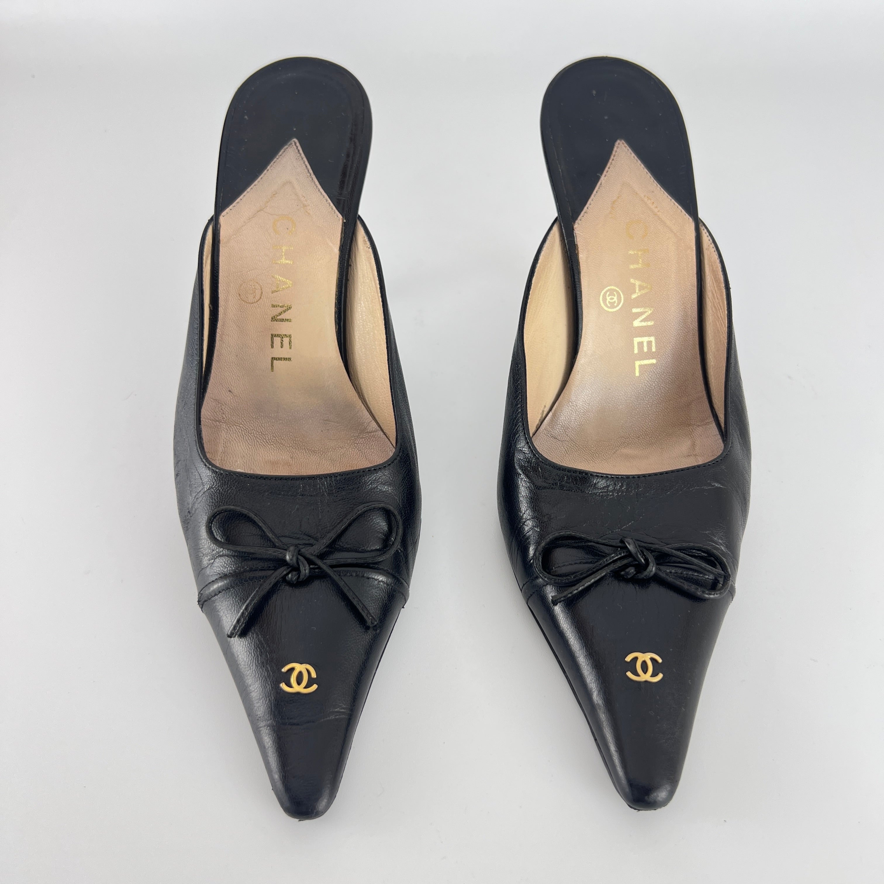 Chanel | Vintage Black Leather CC Logo Bow Pointed Toe Slide Mules (37.5)