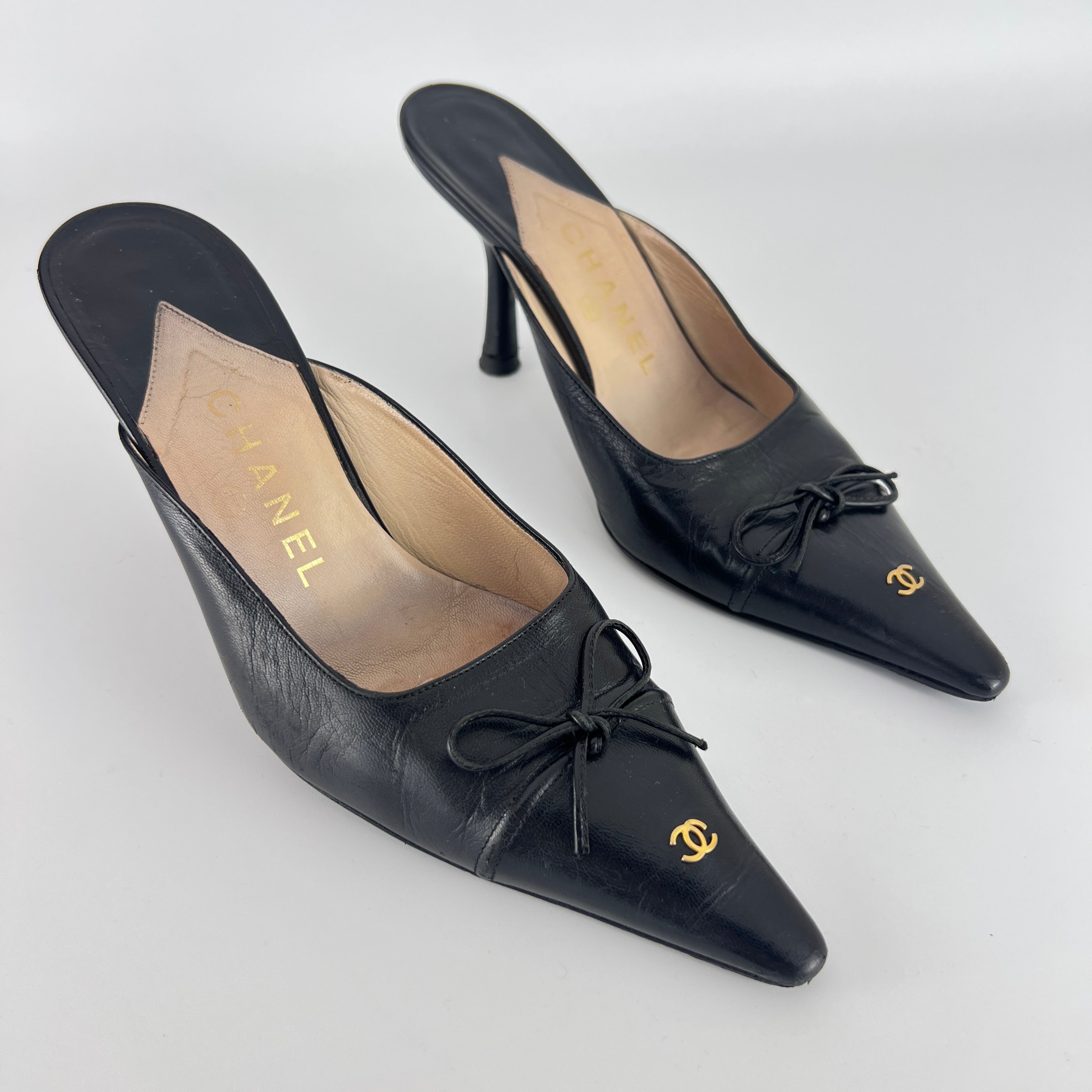 Chanel | Vintage Black Leather CC Logo Bow Pointed Toe Slide Mules (37.5)
