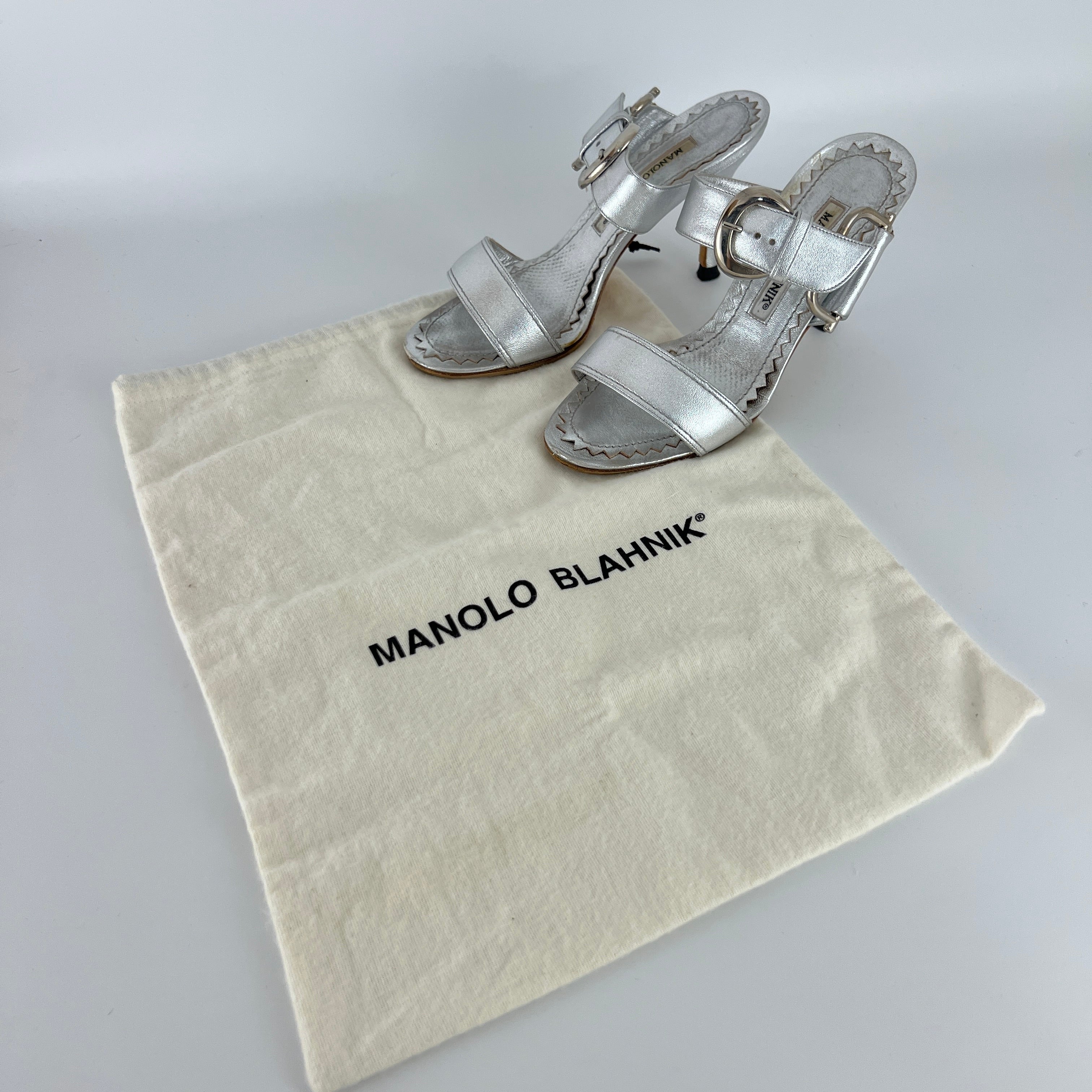 Manolo Blahnik | Metallic Silver Buckle Horsebit Detail Dual Strap Mules (34.5)