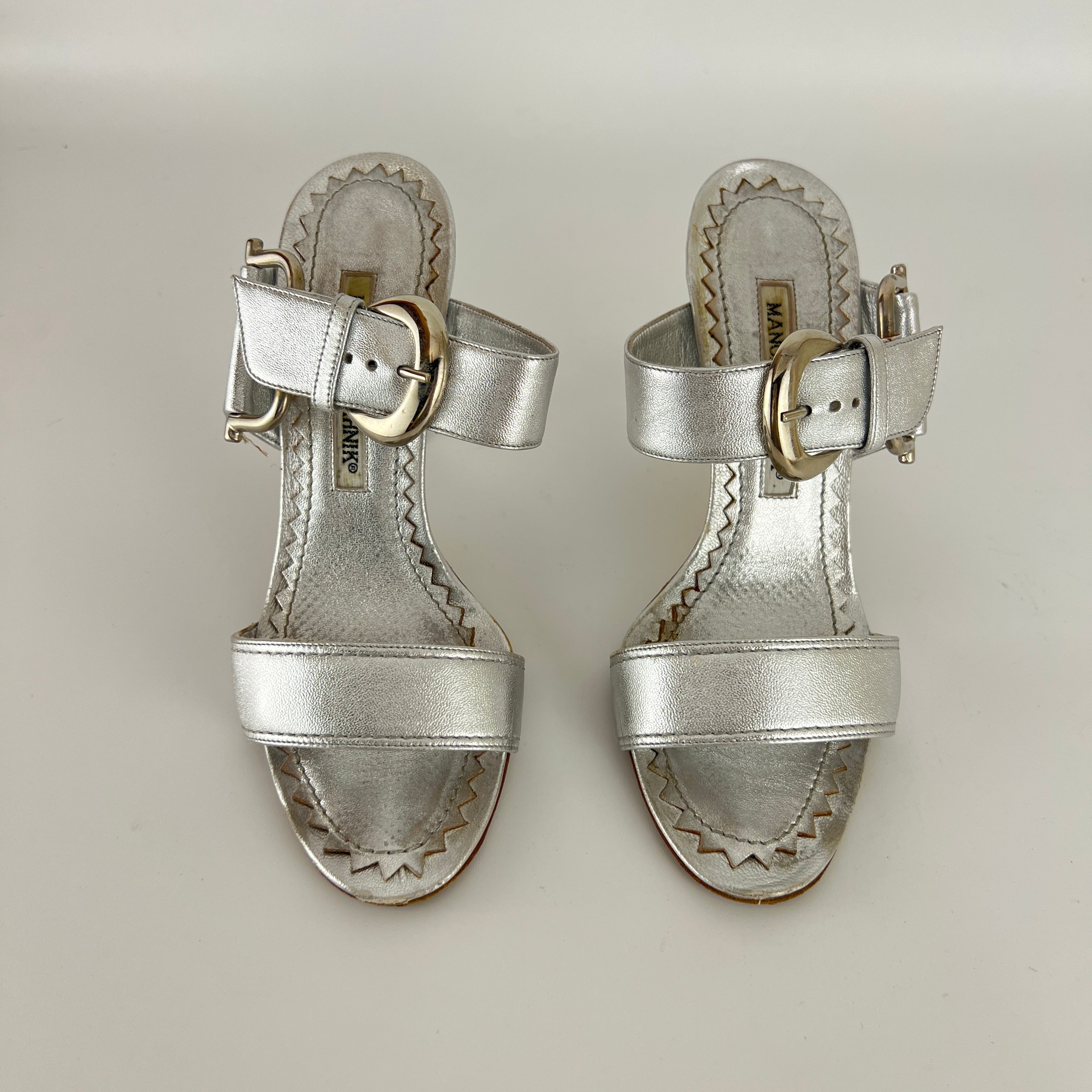 Manolo Blahnik | Metallic Silver Buckle Horsebit Detail Dual Strap Mules (34.5)