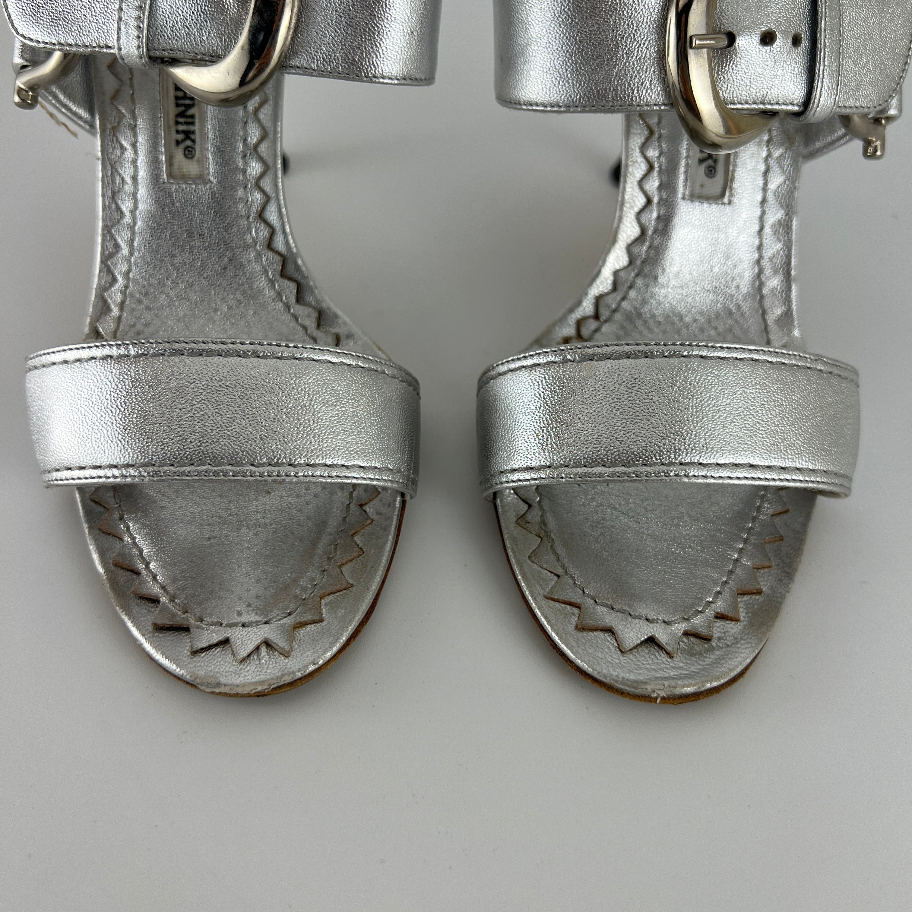 Manolo Blahnik | Metallic Silver Buckle Horsebit Detail Dual Strap Mules (34.5)