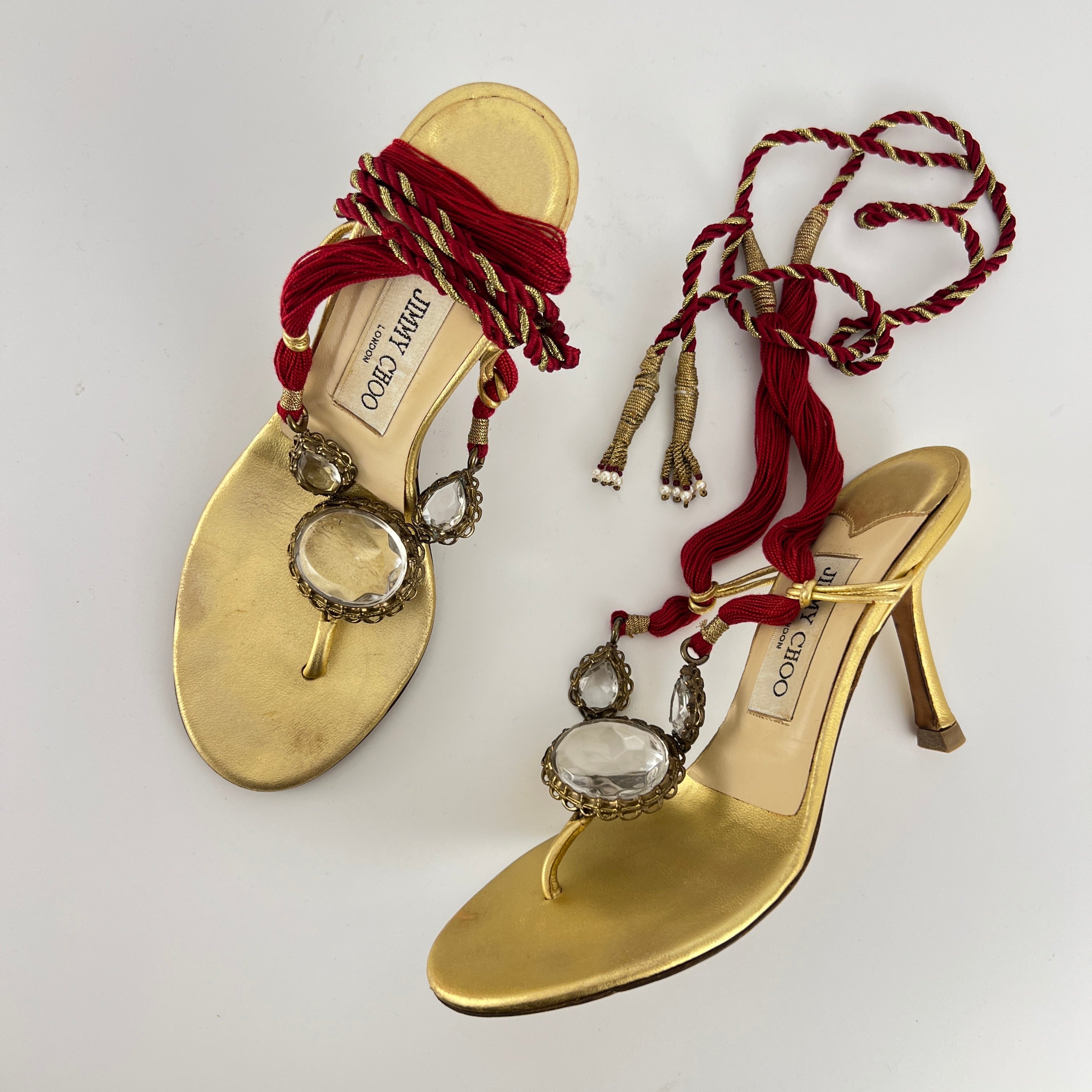Jimmy Choo | Gold Metallic Leather Clear Gem Red Tassel Lace Up Thong Heels (37)