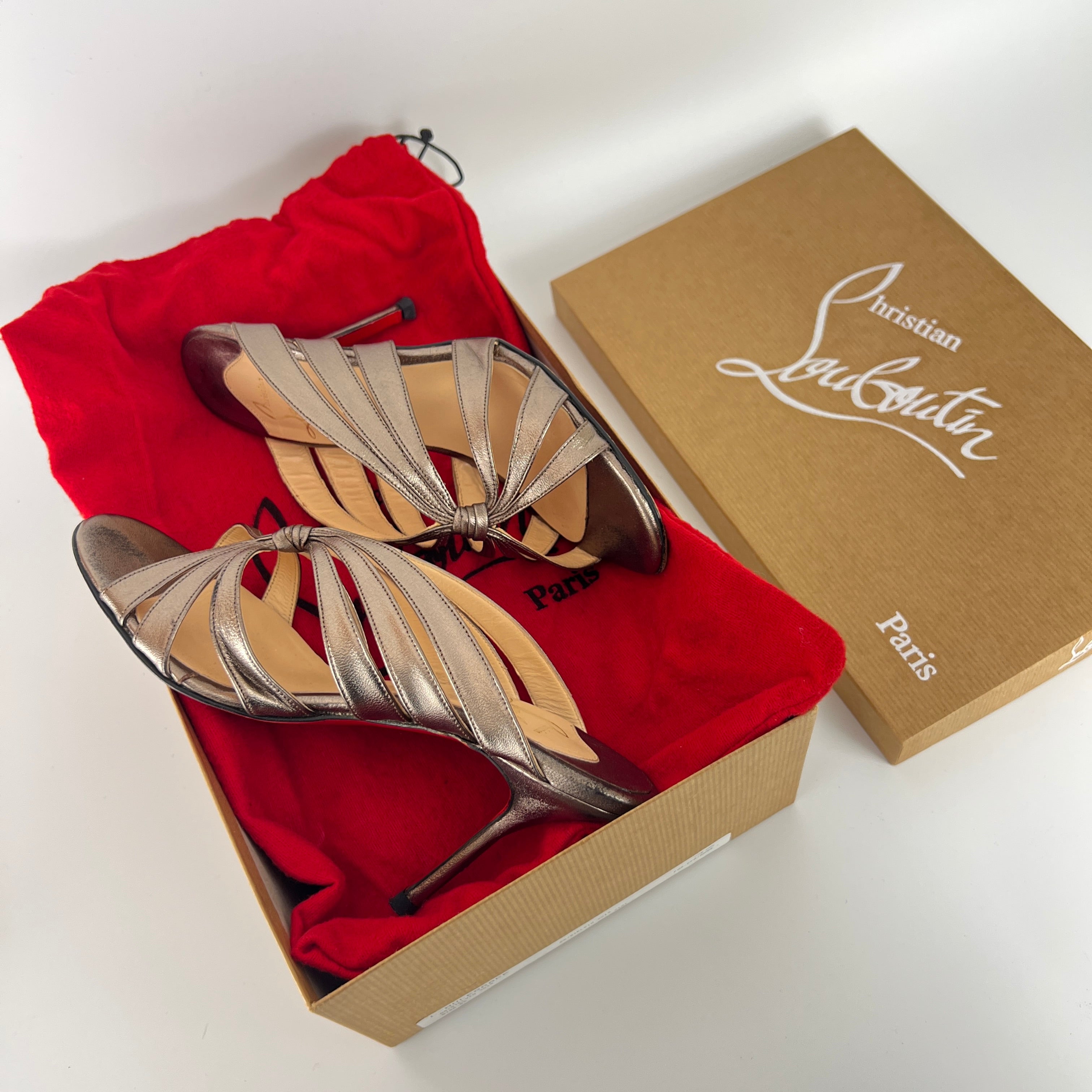 Louboutin | Rose Gold Metallic Leather Twist Strappy Sandal Mule Heels (36)